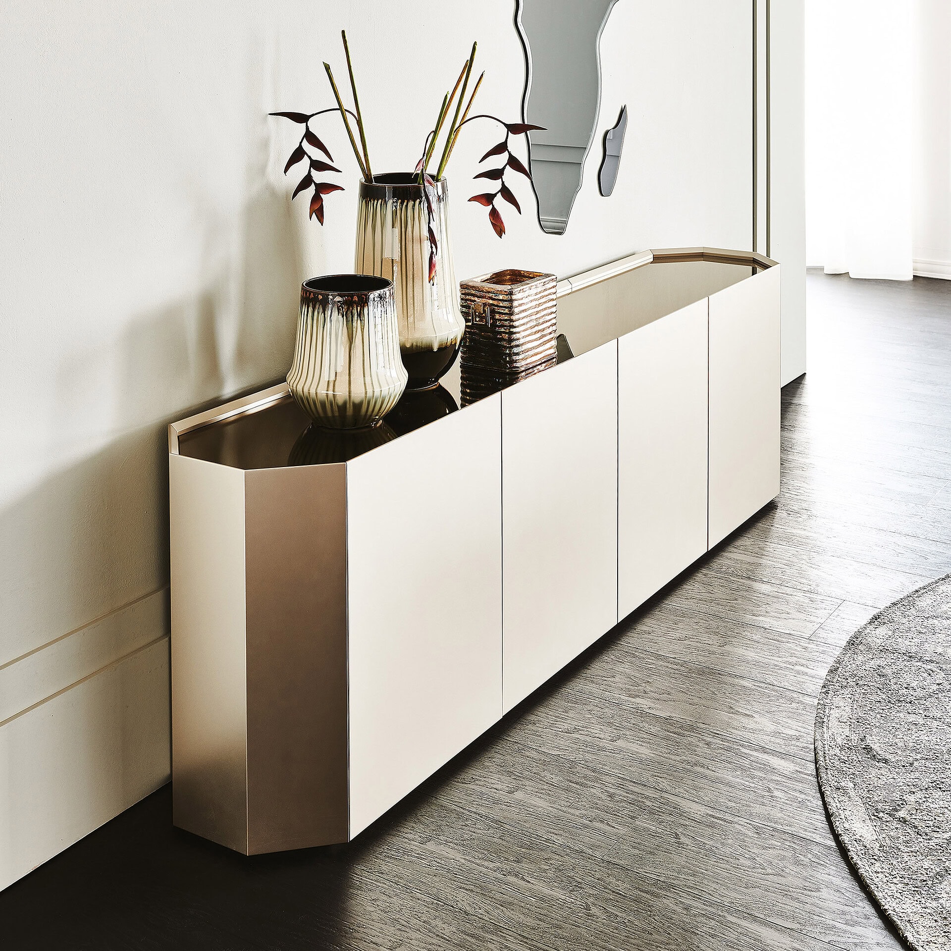 Sleek Chelsea modern sideboard with metallic accents and decorative vases.
