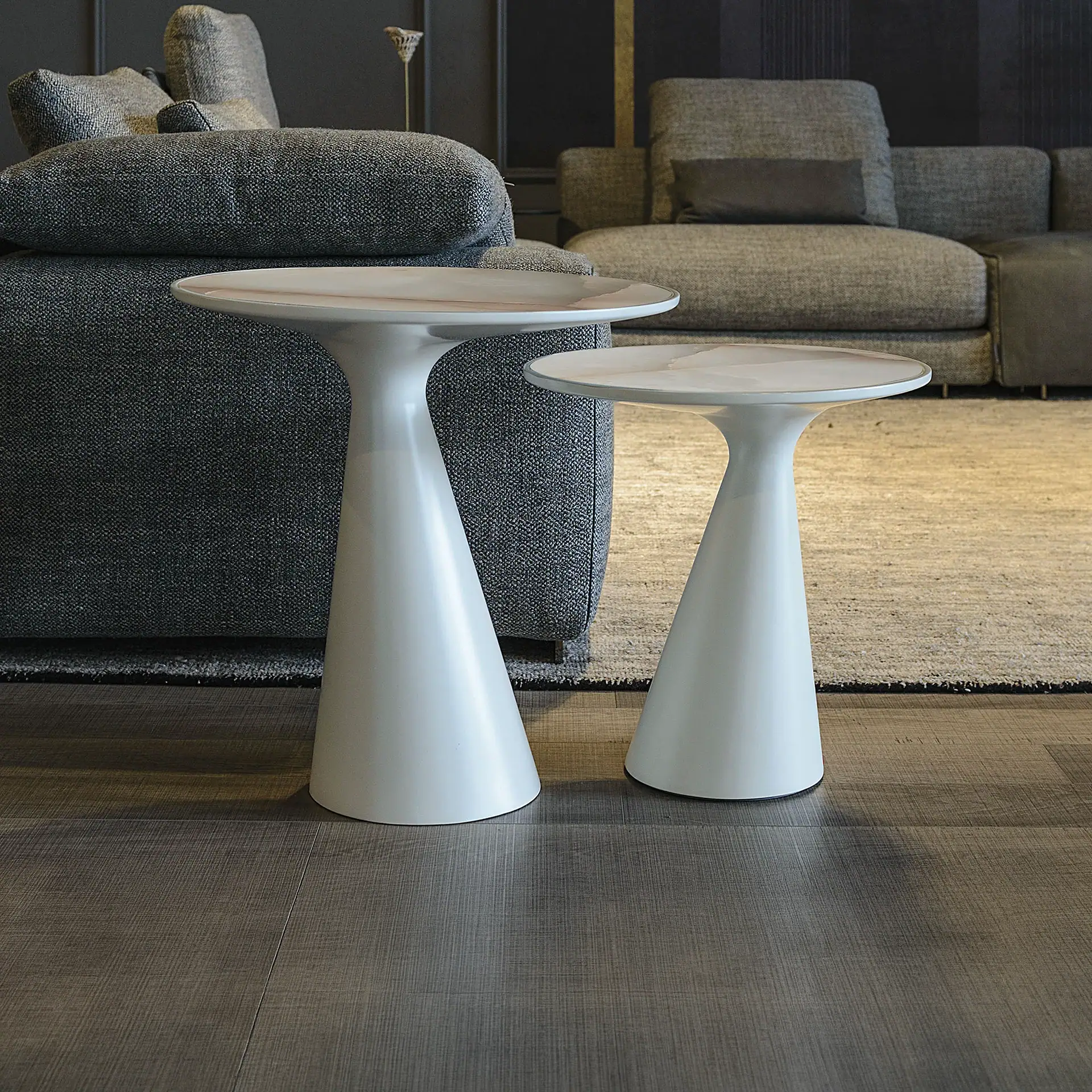 Sklar Furnishings end tables in a modern living room setting.