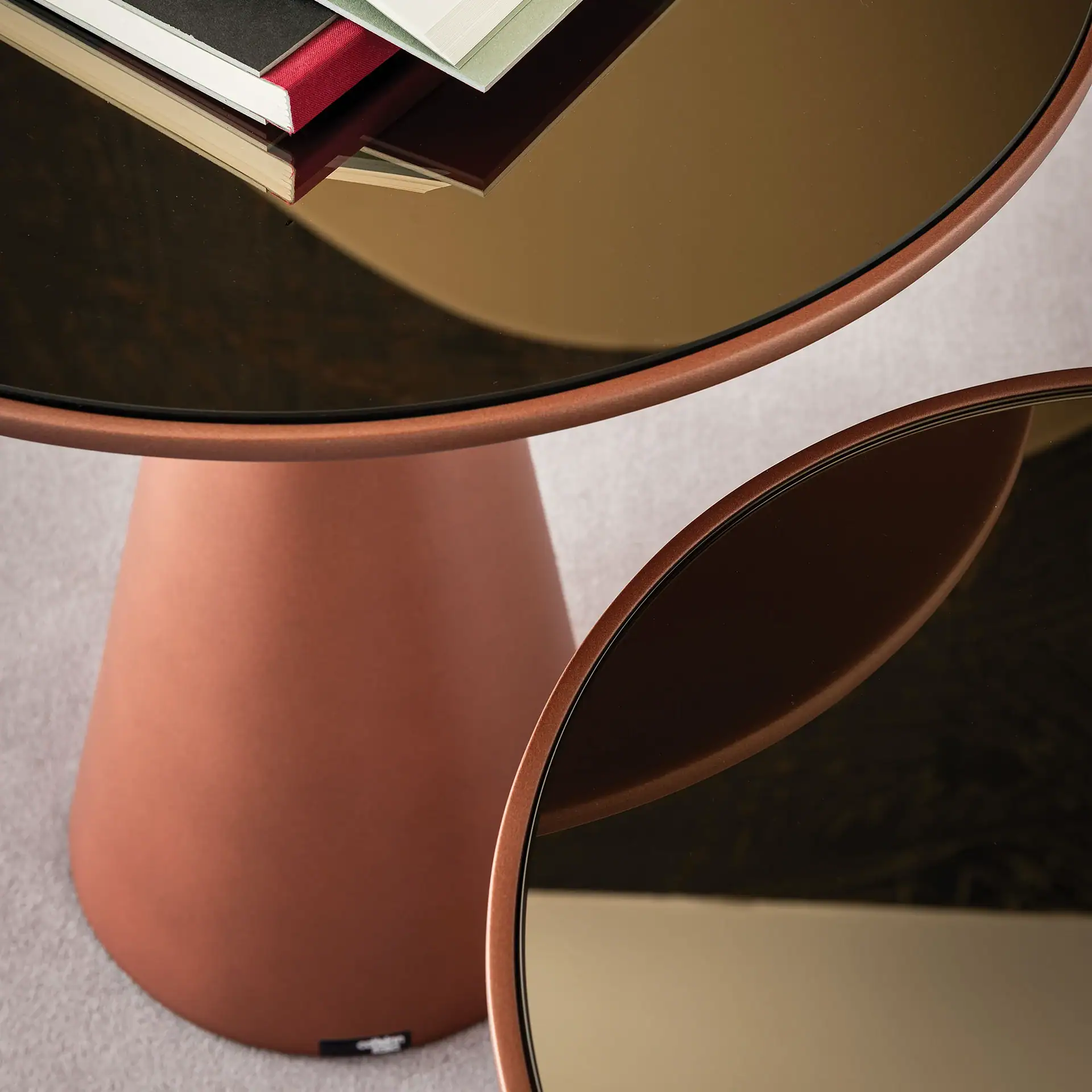 Close-up of Peyote End Table by Sklar Furnishings with books on top.