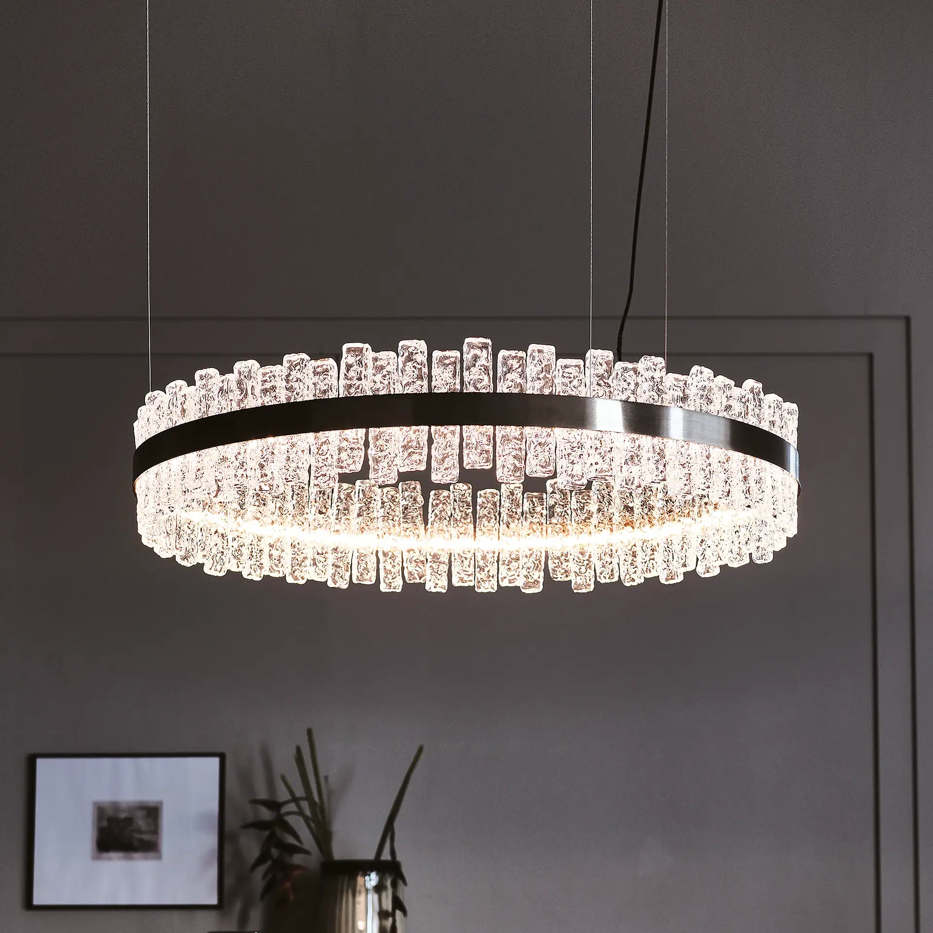 Modern crystal chandelier with glass accents, ideal for upscale living spaces.