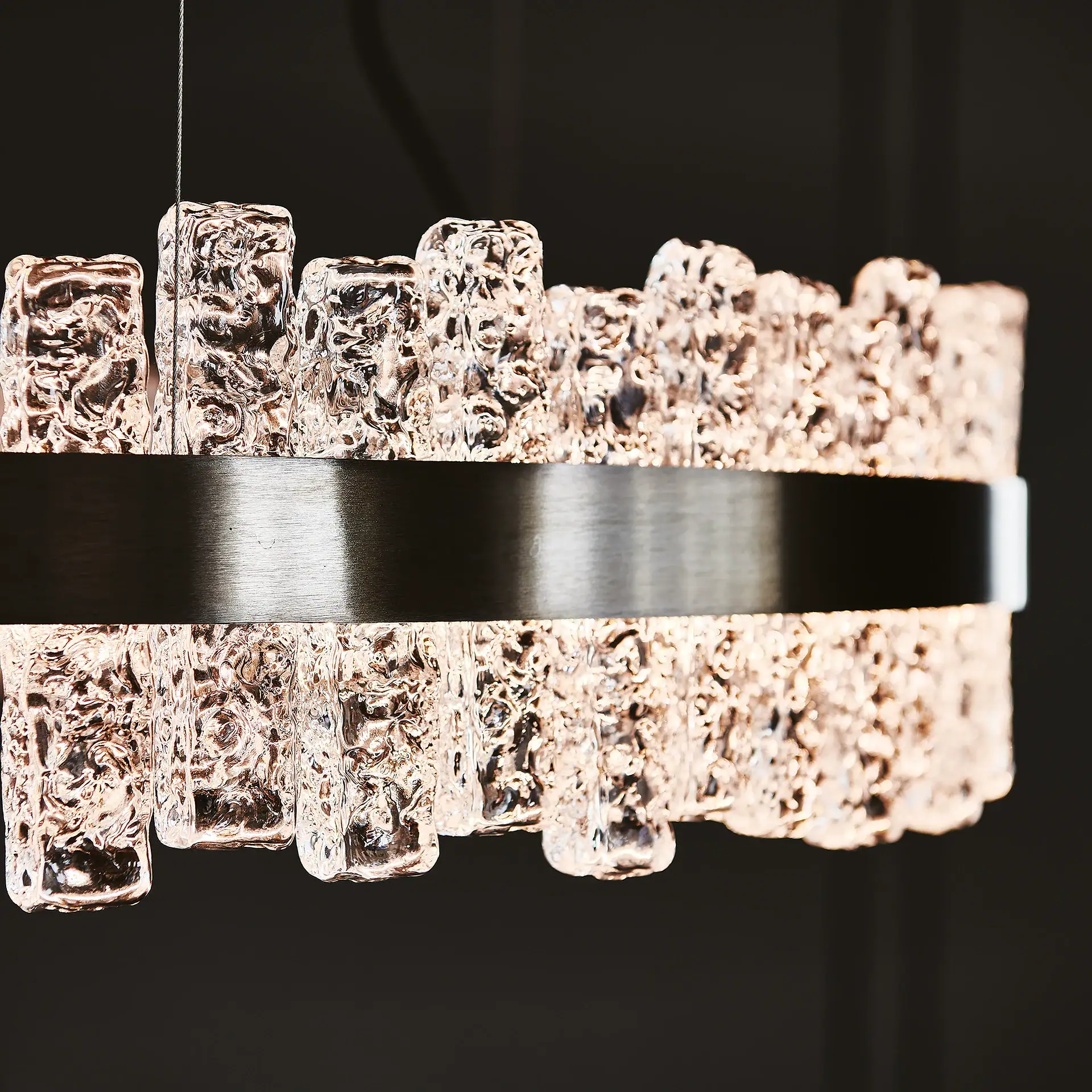 Ice crystal chandelier with a sleek black band, perfect for luxurious interior decor.