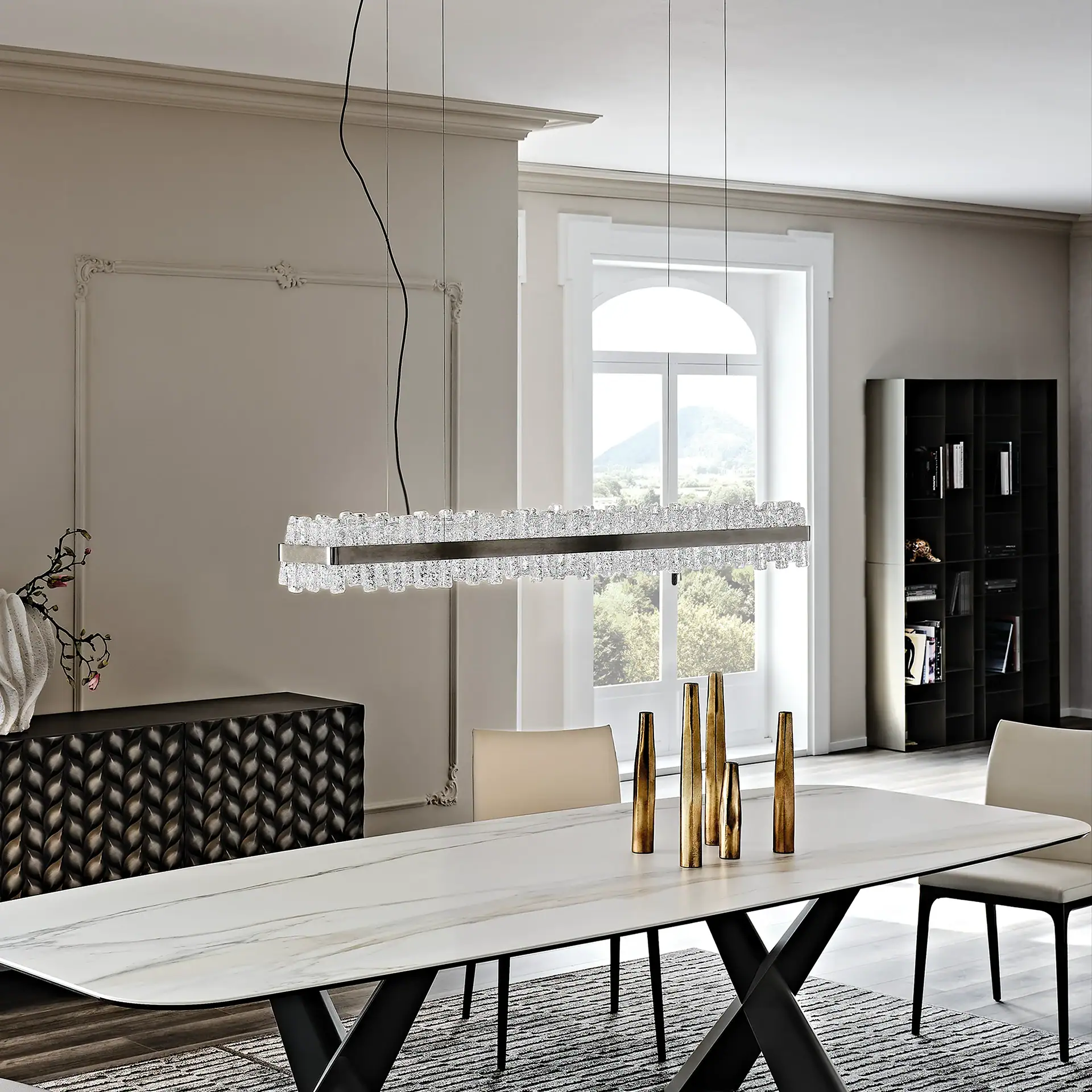 Modern dining room featuring a sleek marble table, stylish chairs, and contemporary lighting.