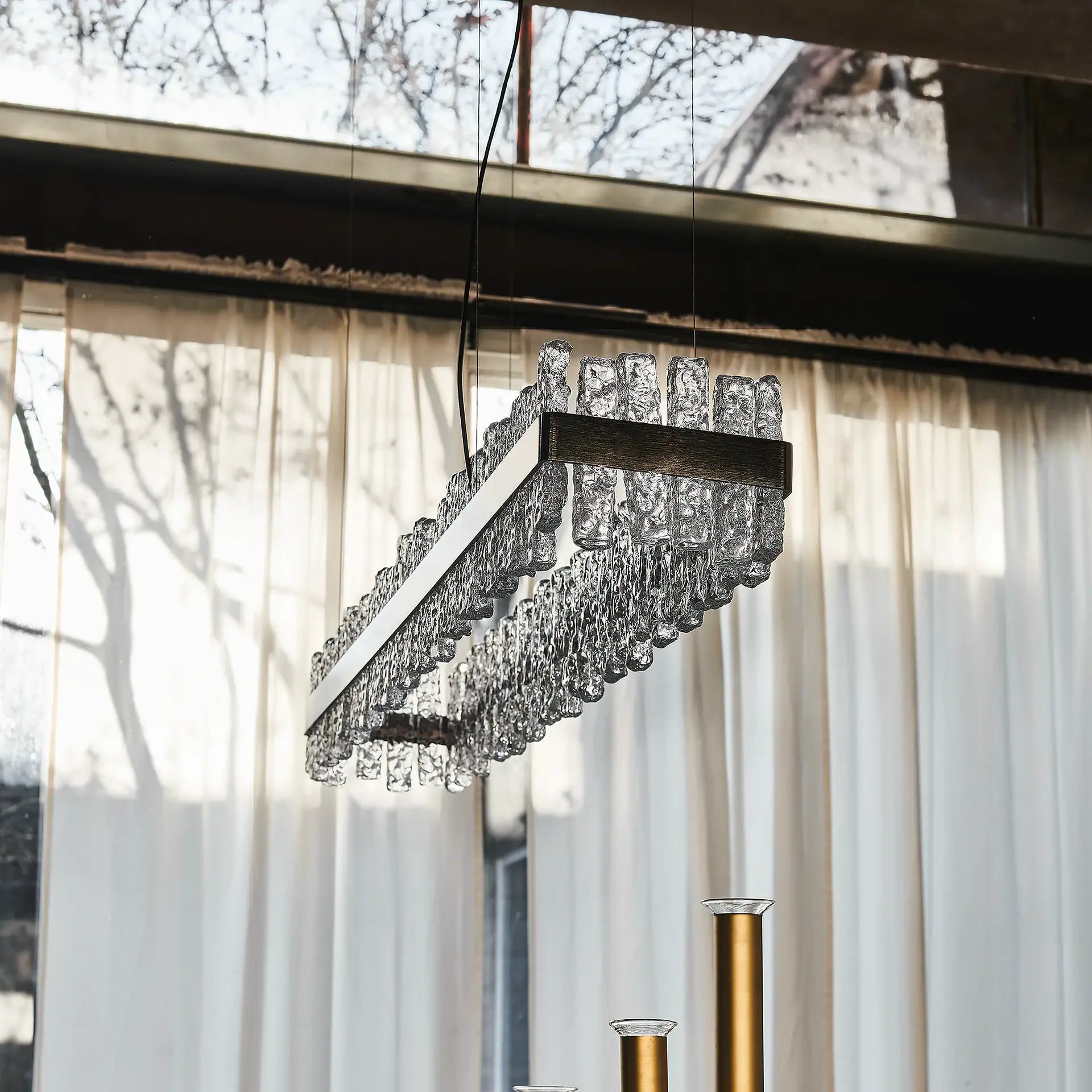 Modern crystal chandelier with sleek design for upscale dining rooms and living spaces.