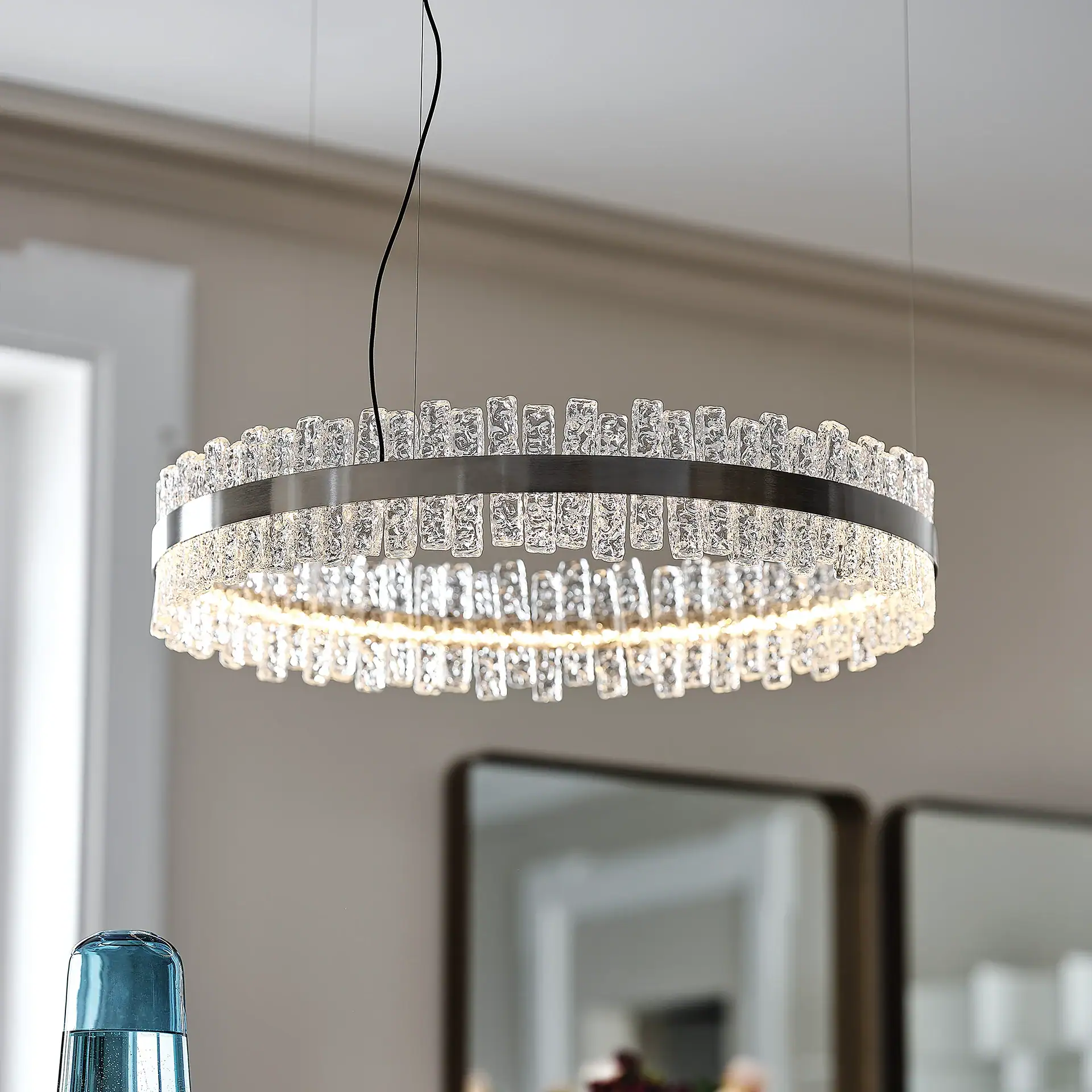 Crystal chandelier hanging in a contemporary living space.