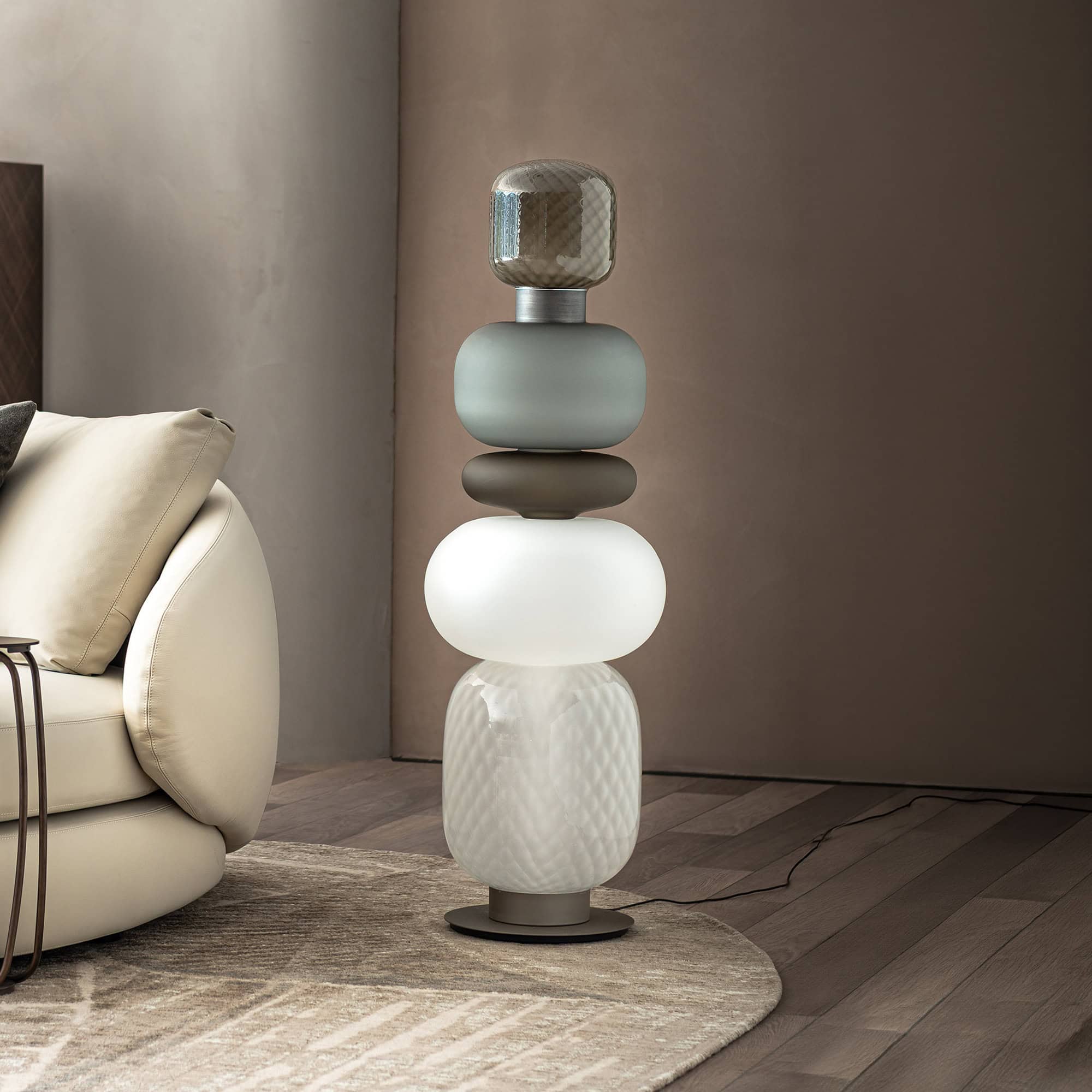 Elegant Pigalle glass floor lamp with stacked, rounded shapes in neutral tones.