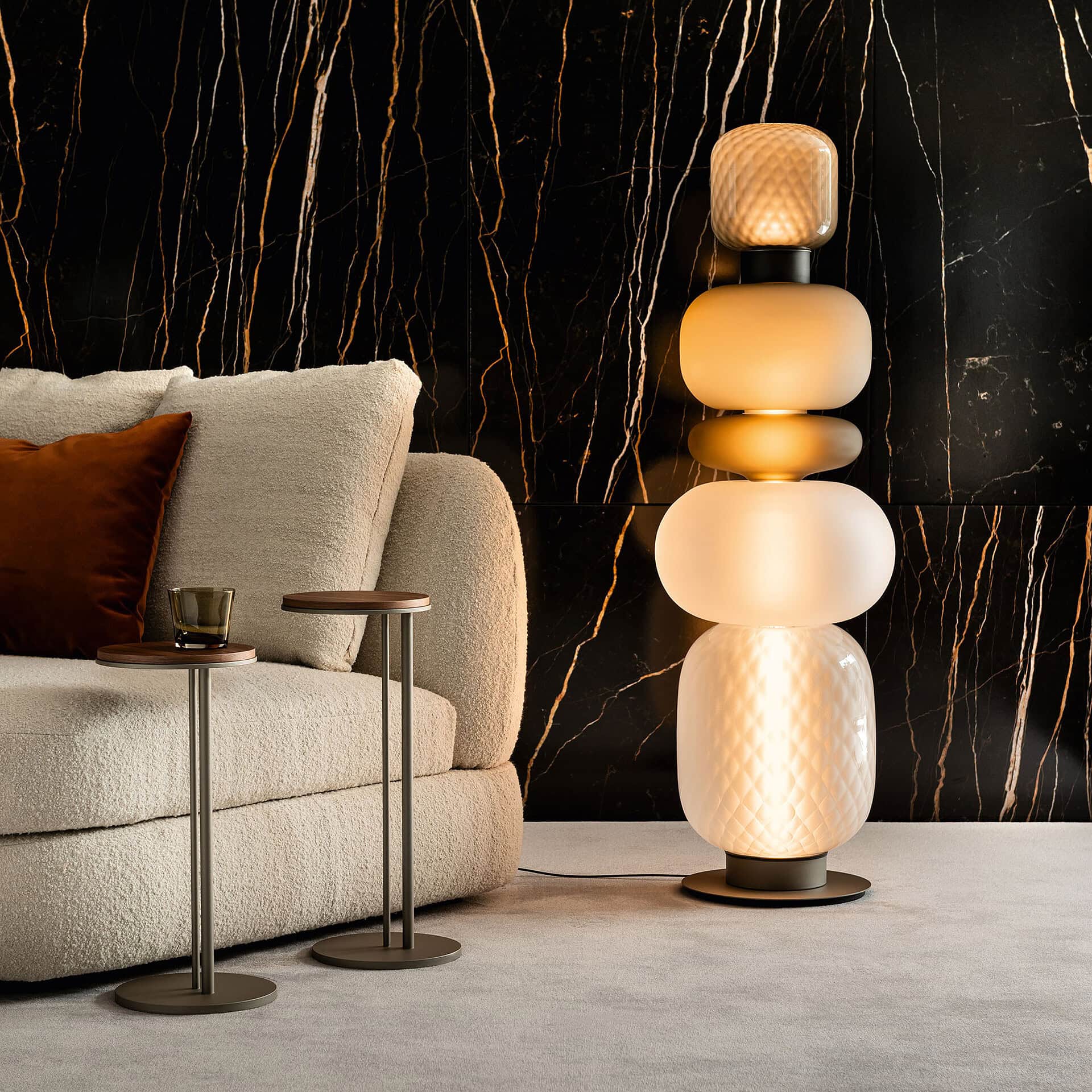 Elegant Pigalle glass floor lamp with modern design. Perfect for contemporary living spaces.