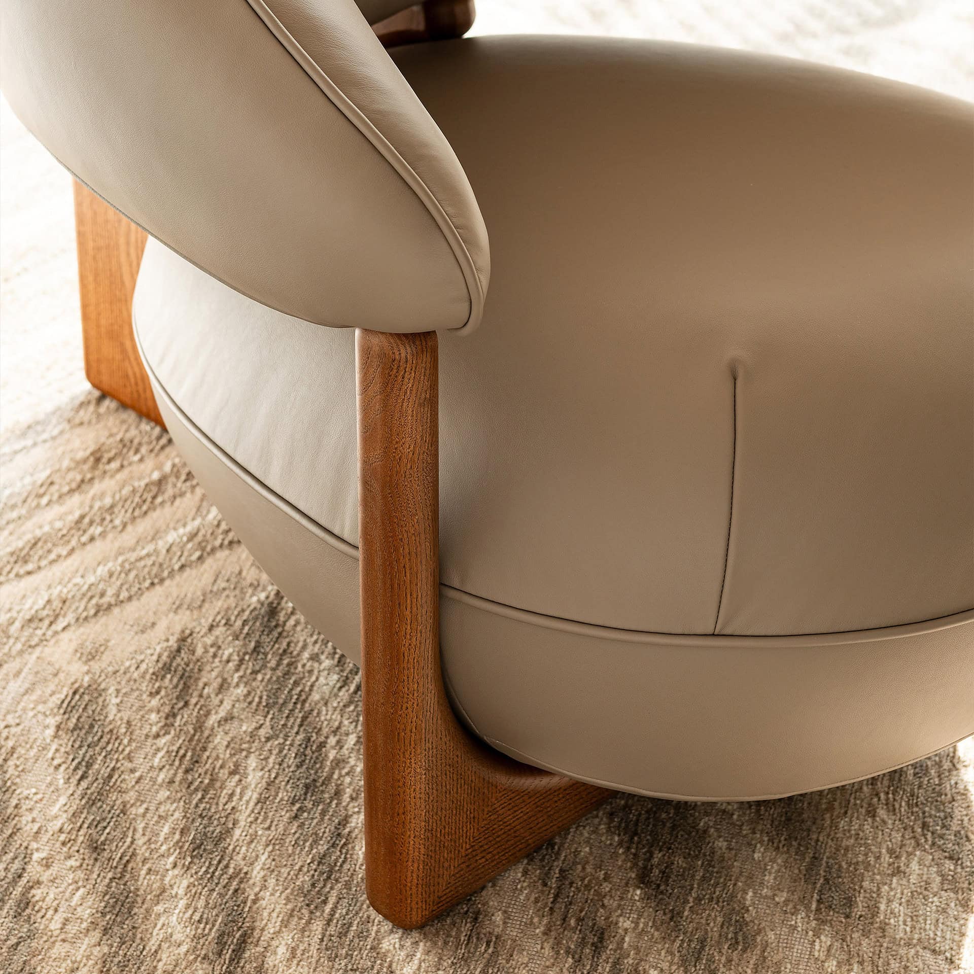 Comfortable Ruby Lounge Armchair featuring sleek wooden legs and plush upholstery. Perfect for moder.