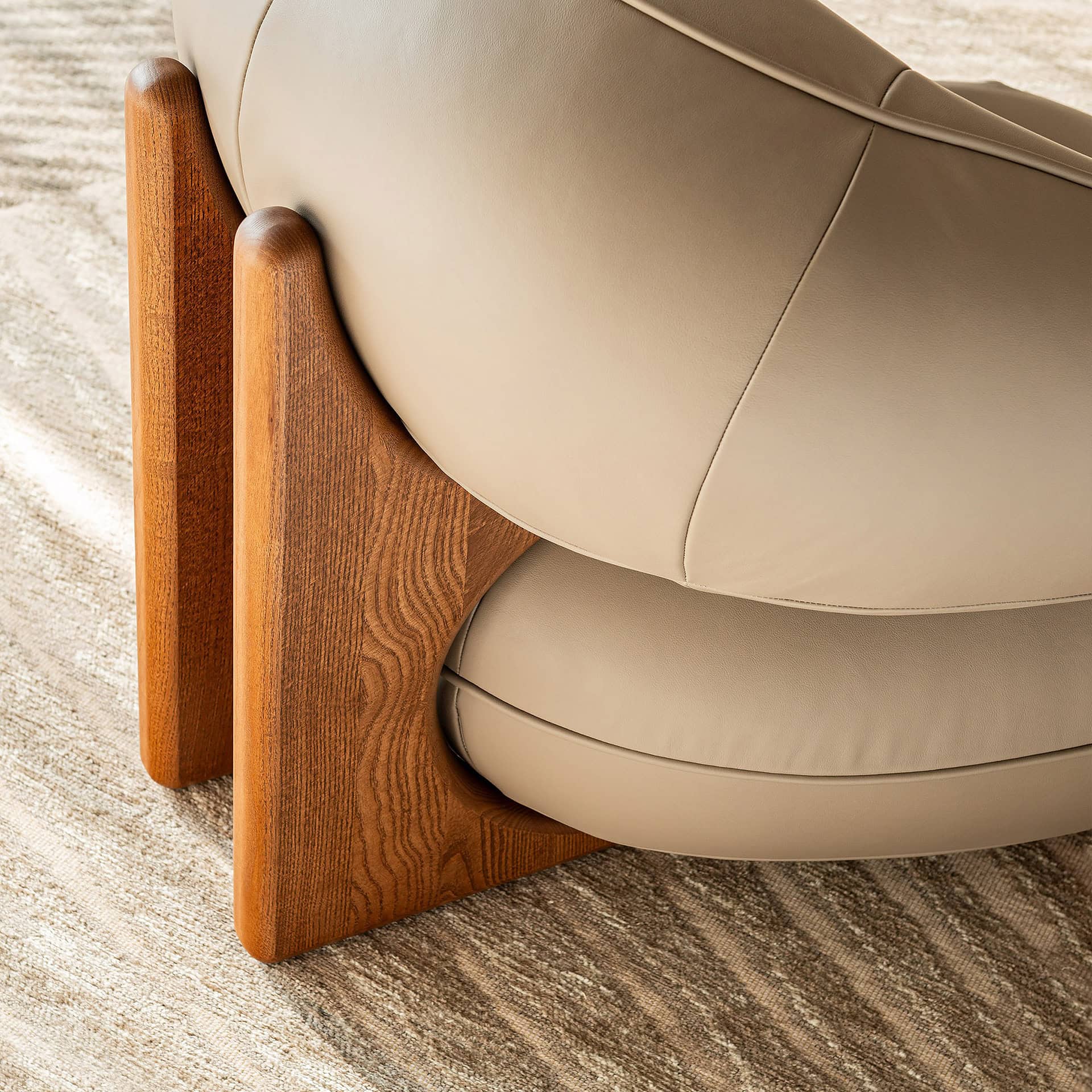 Elegant Ruby Lounge Armchair featuring wooden legs and plush beige fabric for stylish comfort.
