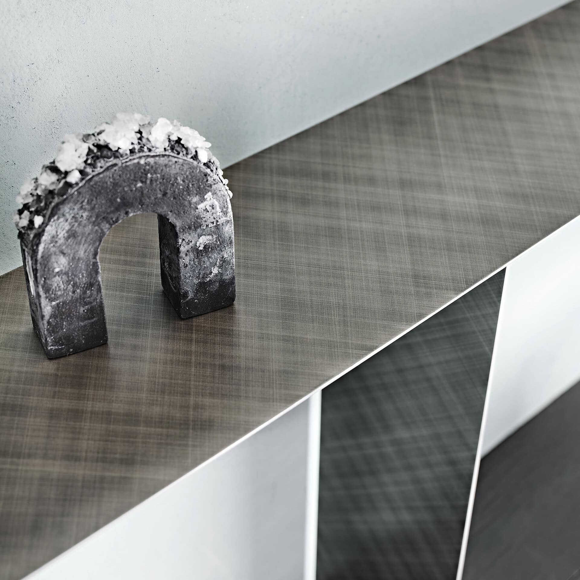 Modern Tee Console Table with unique decorative arch accent.