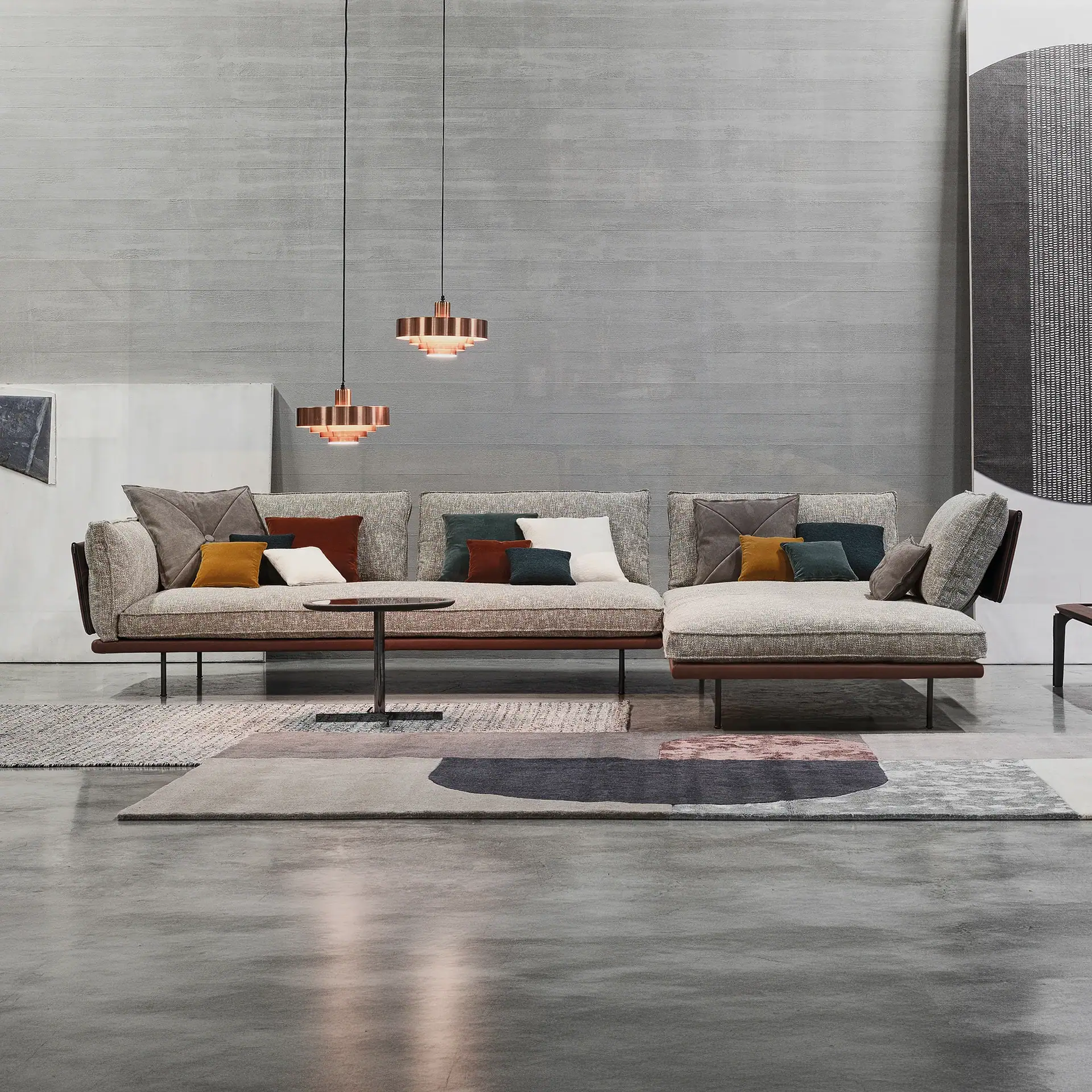 Sklar Furnishings modular sectional sofa with colorful cushions in modern living room.
