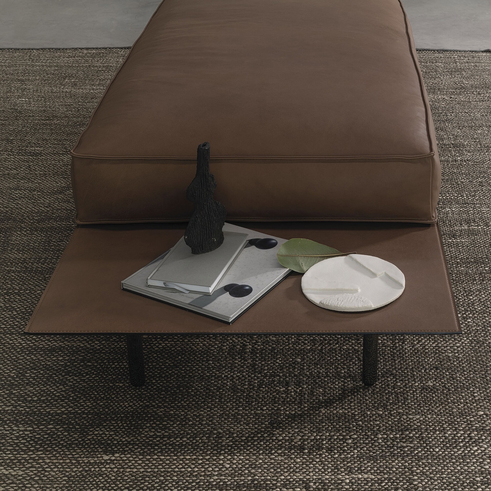 Vogue Leather Coffee Table with accessories in modern living room.