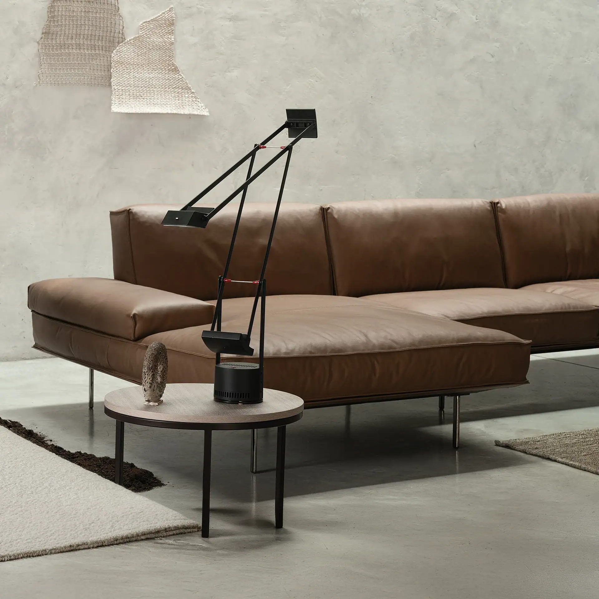 Modern brown leather sectional sofa in contemporary living room setting.