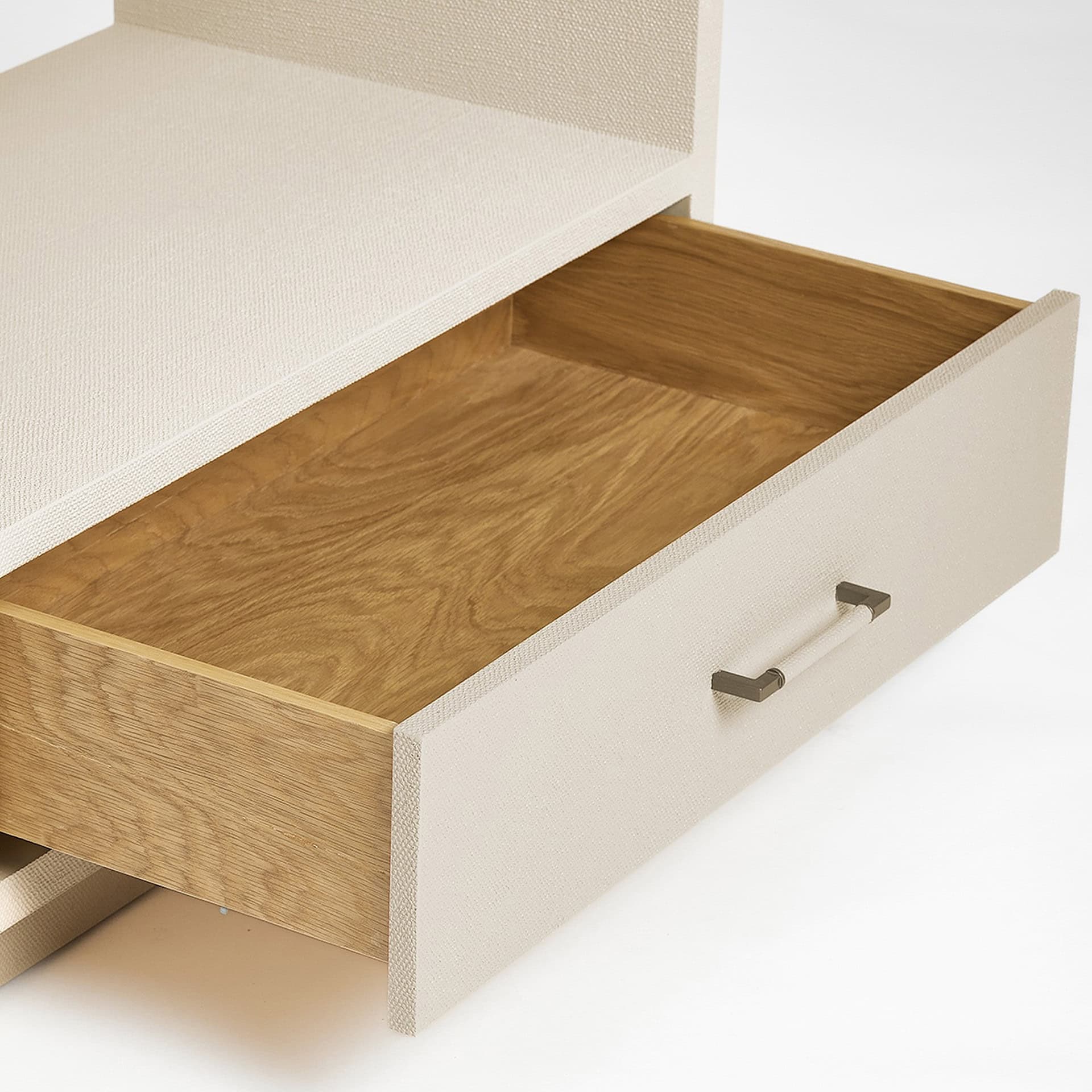 Modern white nightstand with wooden drawer for bedroom storage.