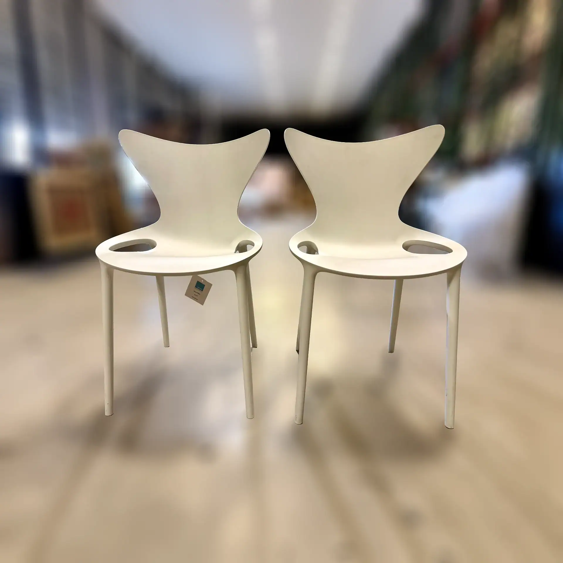 Pair of Vondom Love outdoor dining chairs in white.