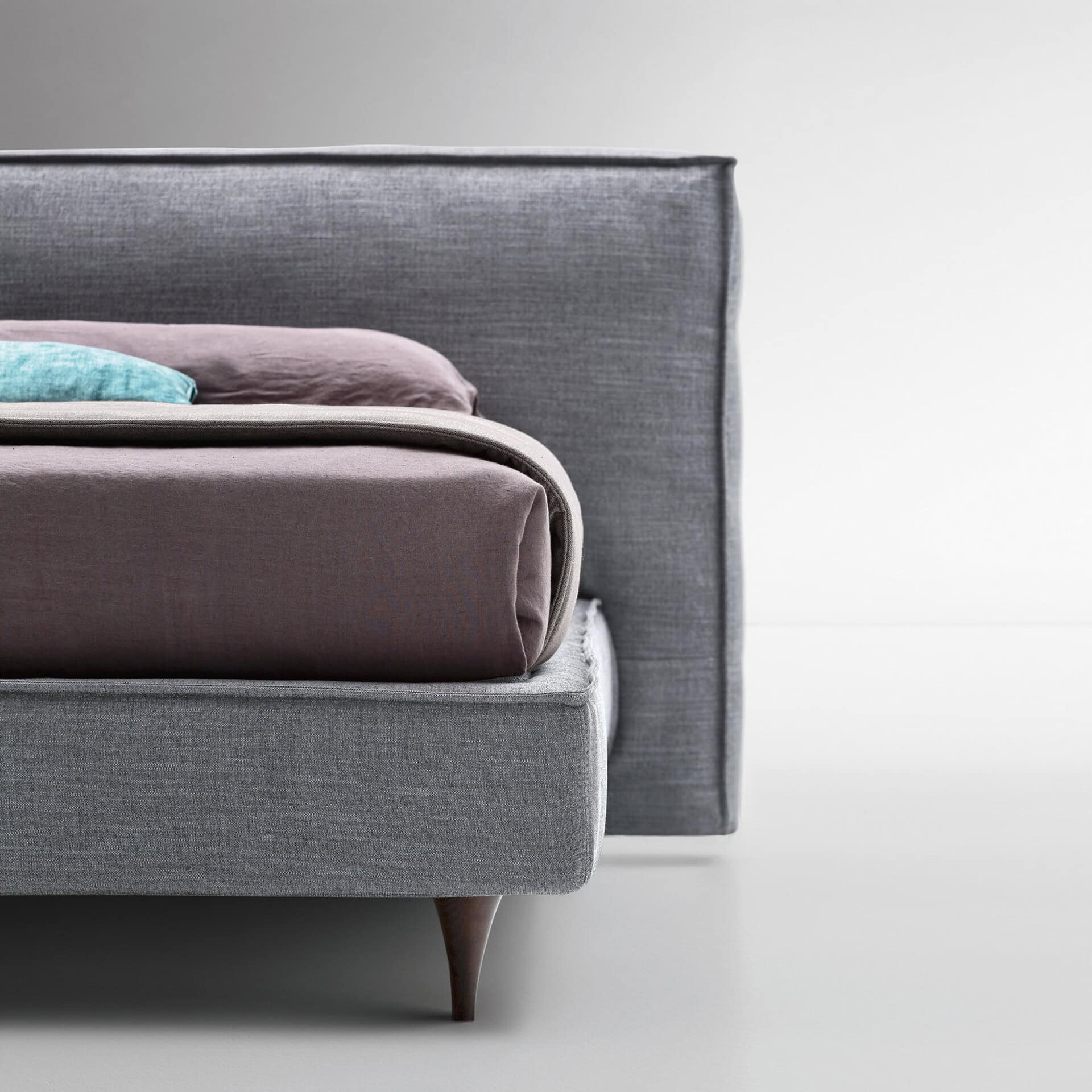 Upholstered Flann 2.0 platform bed with sleek gray fabric and modern design.