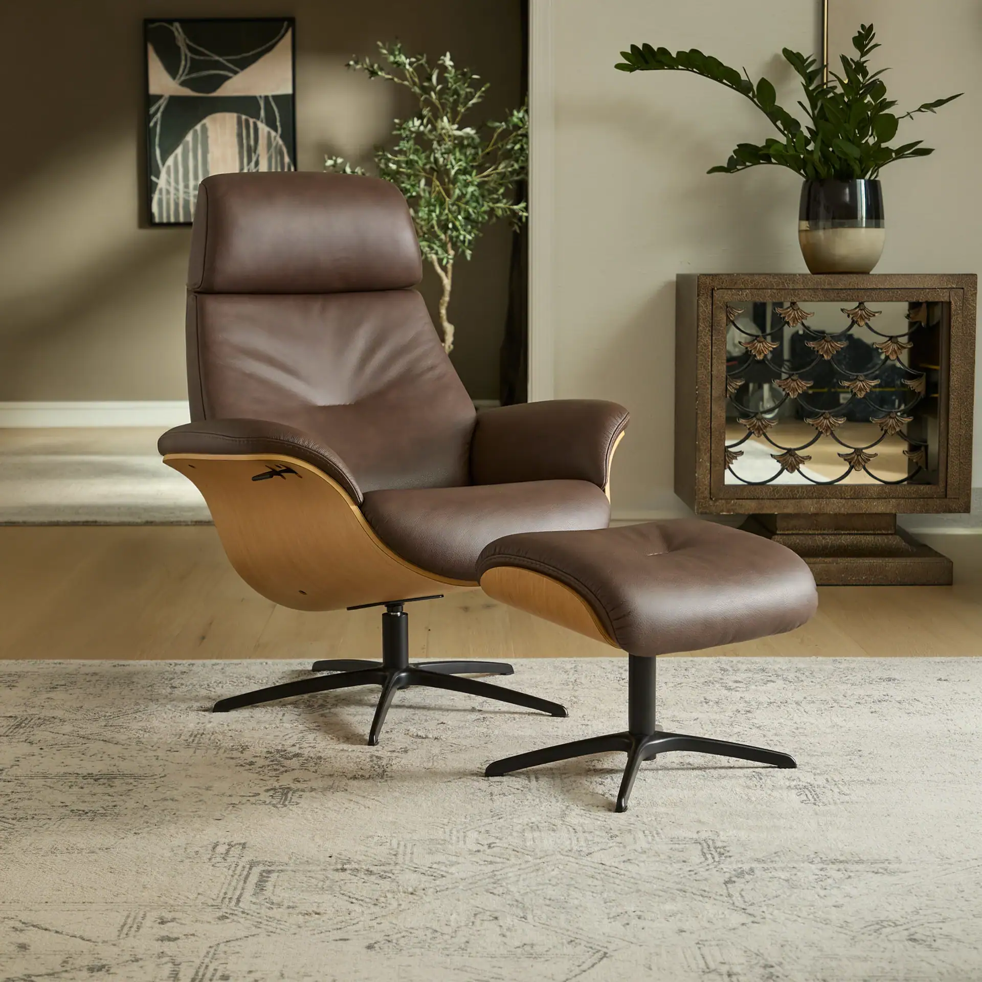 Sklar Furnishings recliner and ottoman in a modern living room setting.
