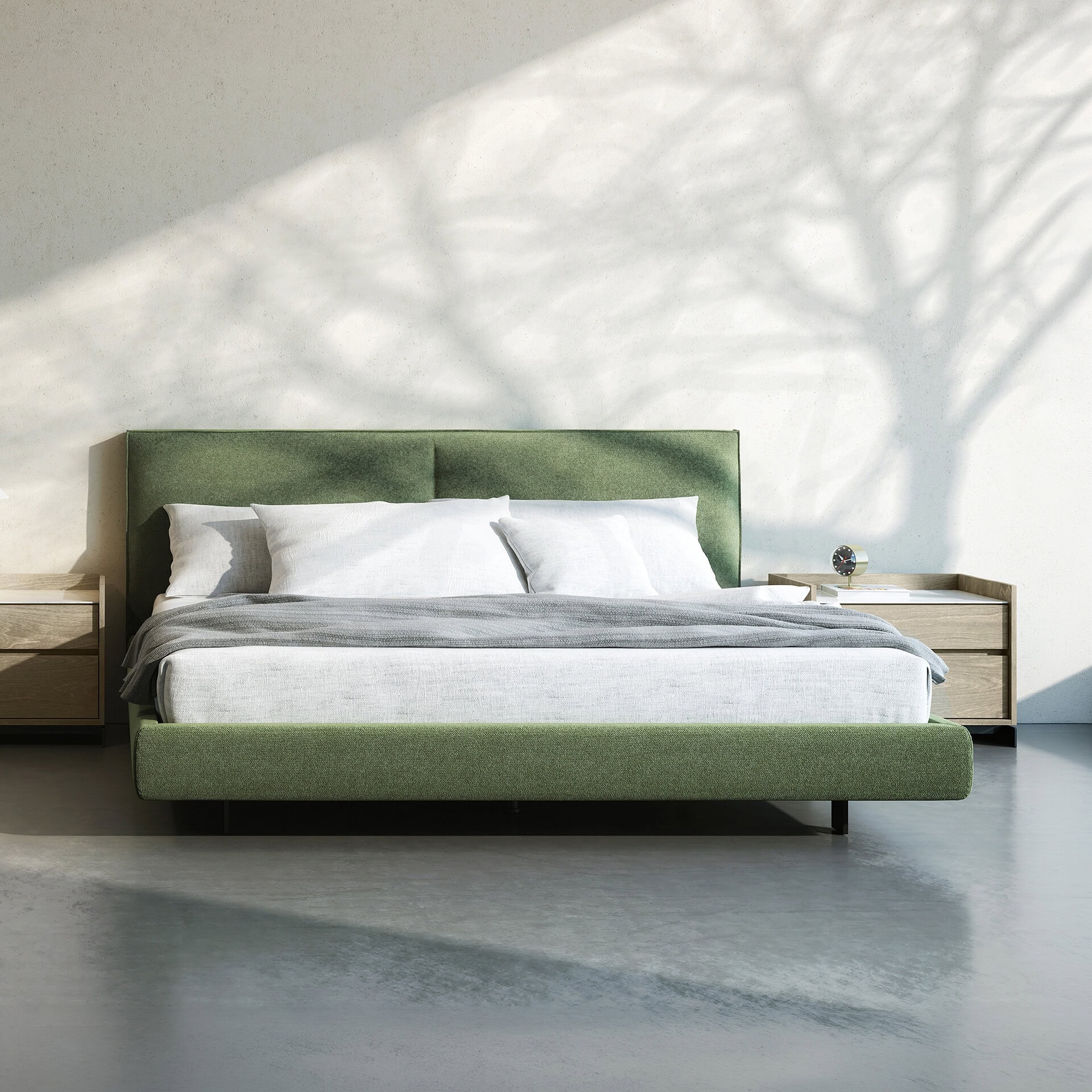 Elegant green platform bed with matching nightstands in a contemporary bedroom setting.