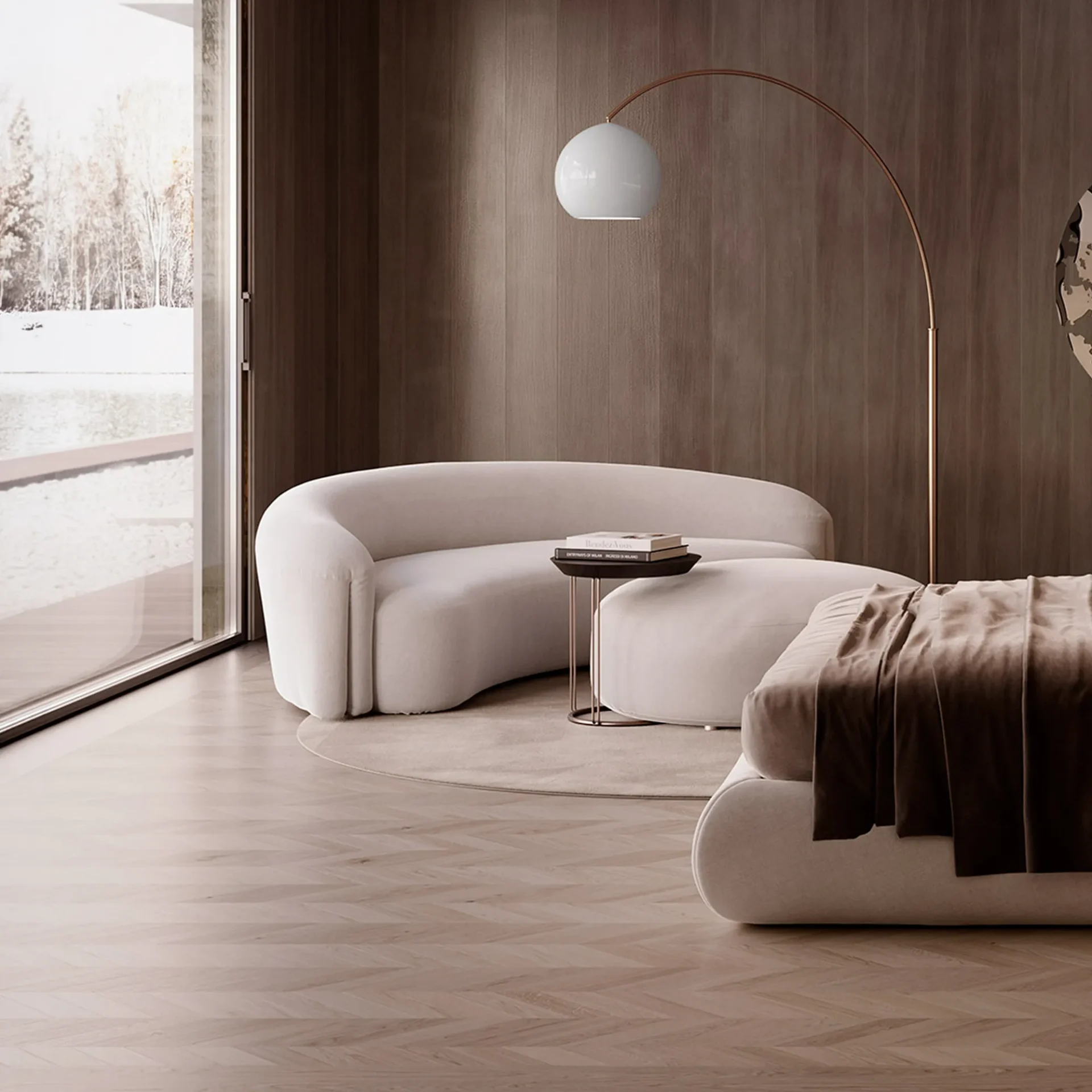 A modern living room with a curved white sofa, matching ottoman, and a bed, all set against dark wood paneling and a large window overlooking a snowy landscape.