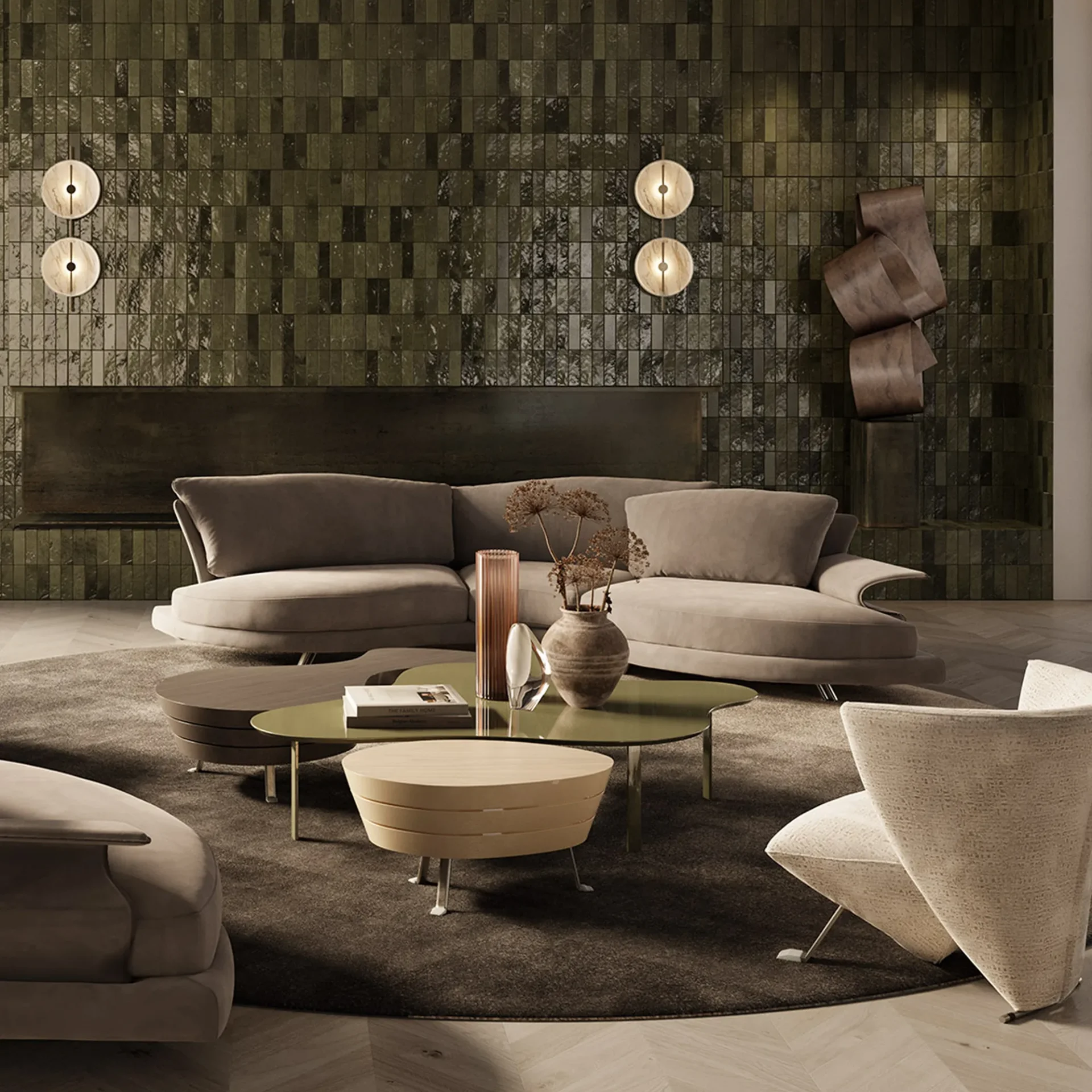 A modern living room with a large curved light brown sofa, multiple coffee tables, a dark green tiled wall with circular sconces, and a sculptural armchair.