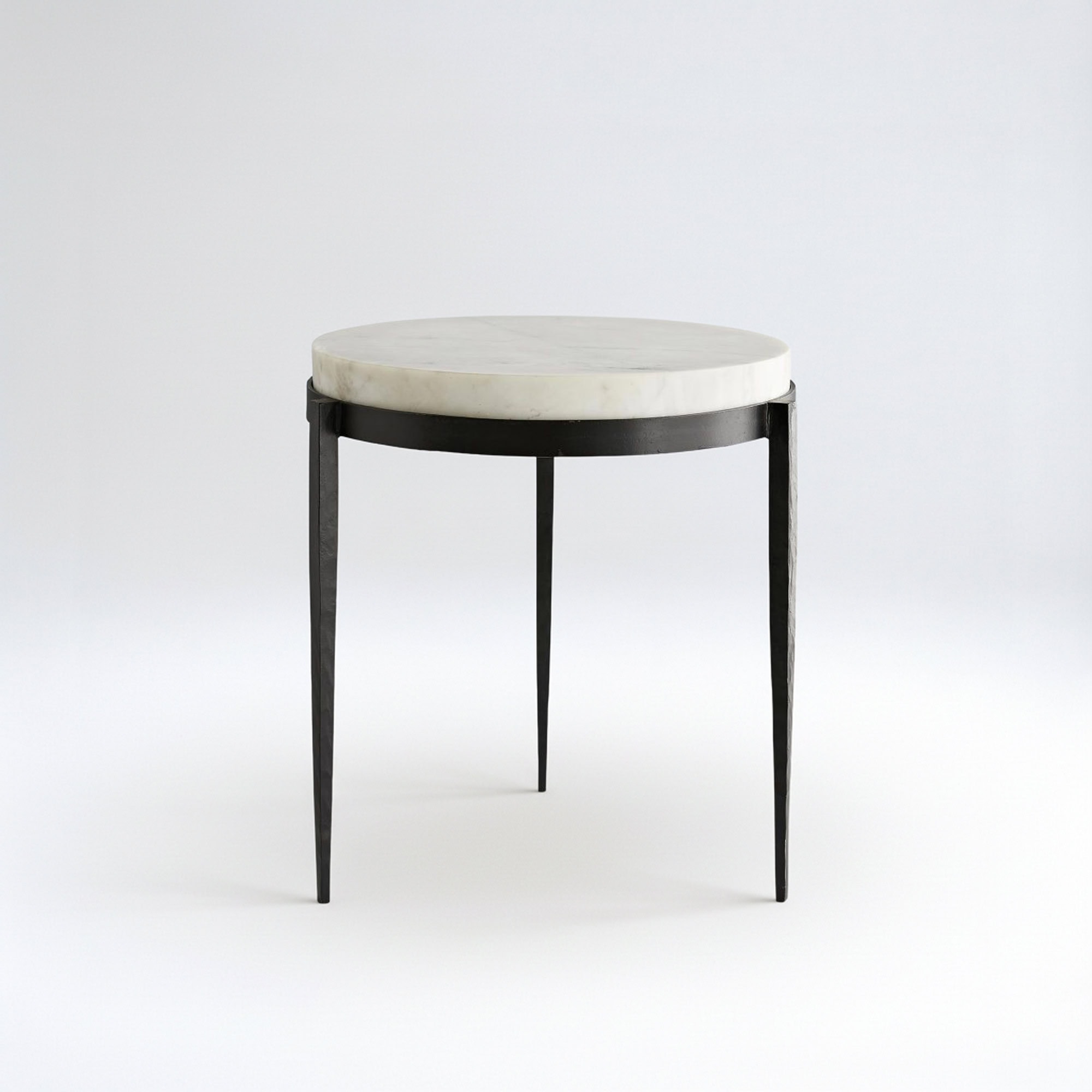 Elegant marble end table with black metal legs for modern living spaces.