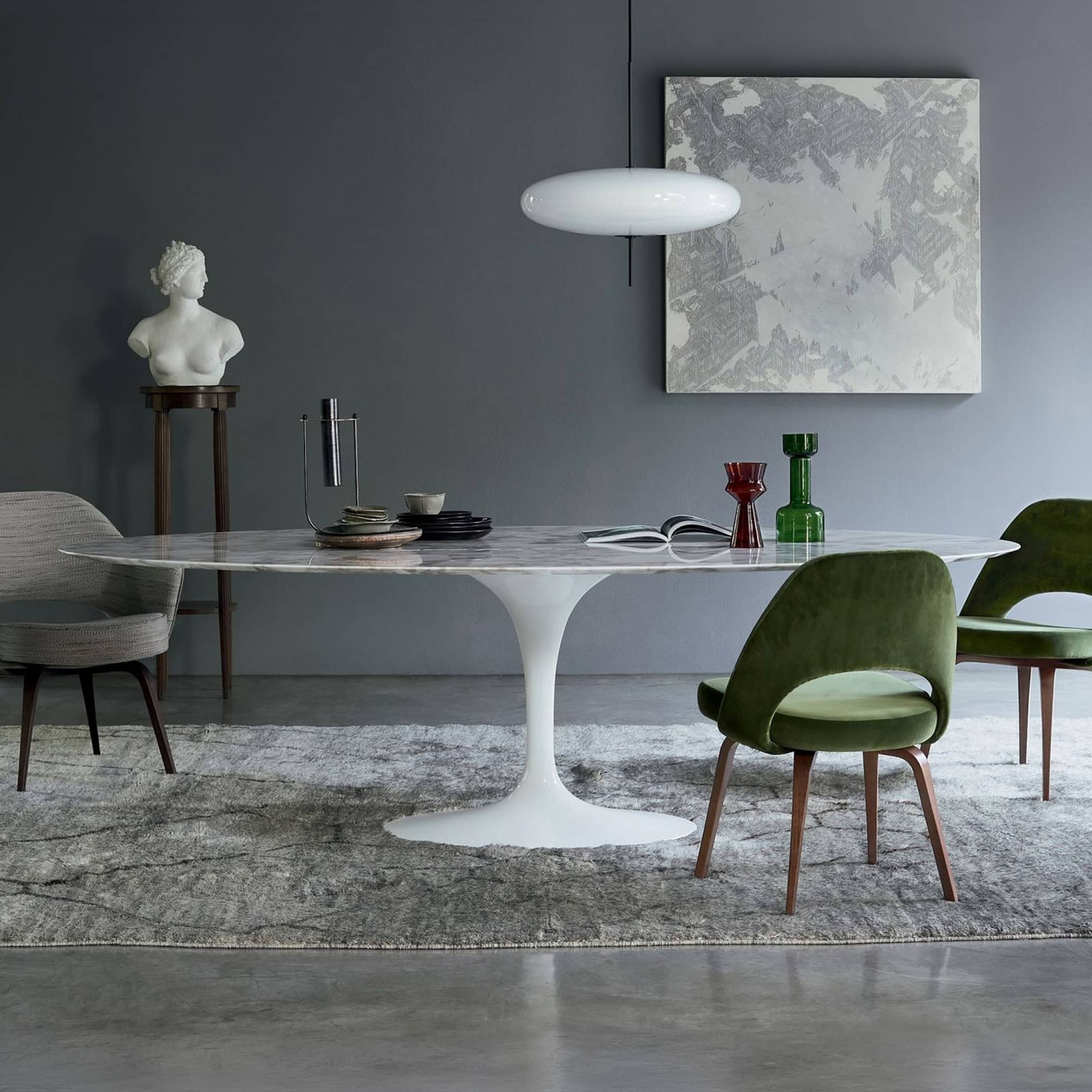 Modern Saarinen sculptural dining table with sleek white finish.