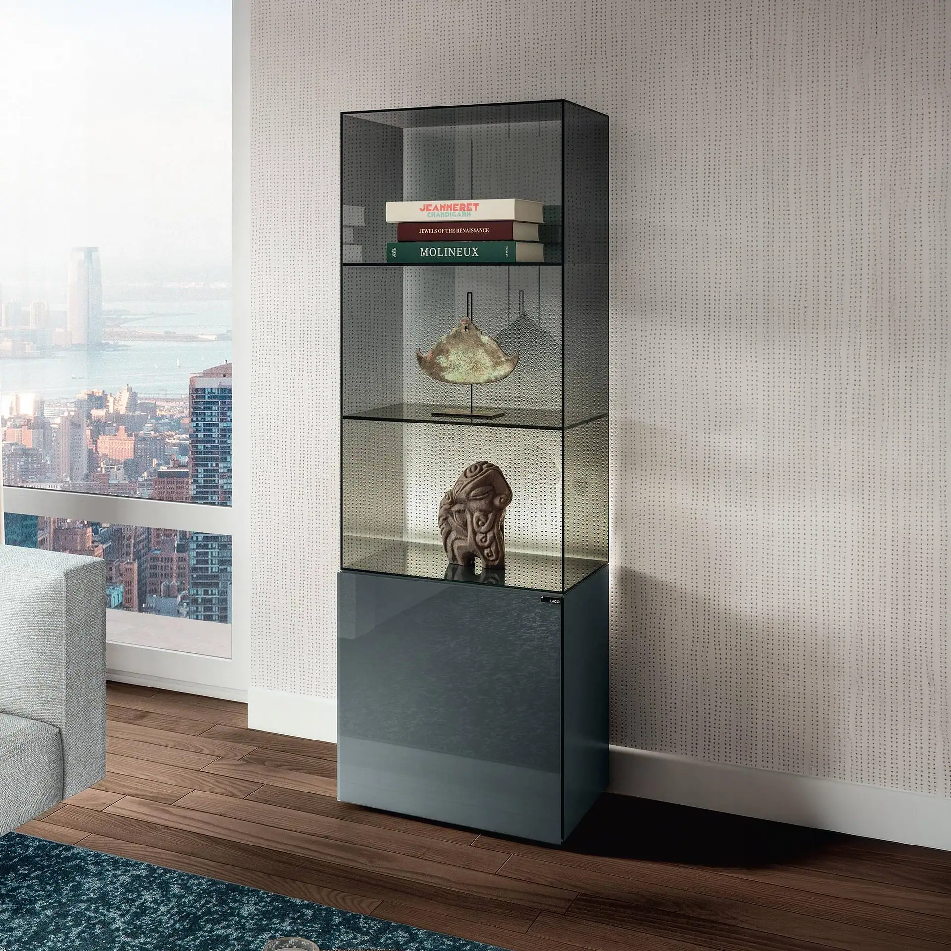 Sklar Furnishings glass display cabinet with decorative items inside.