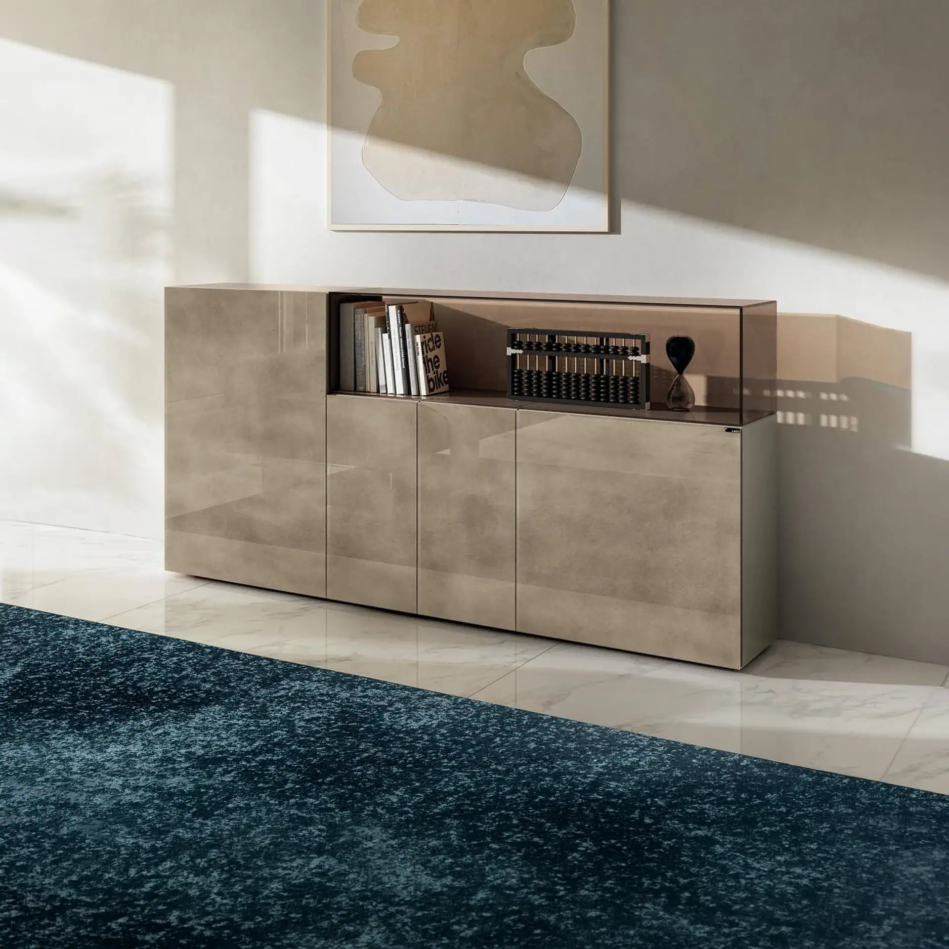 Sklar Furnishings glass sideboard with books and decor in modern room.