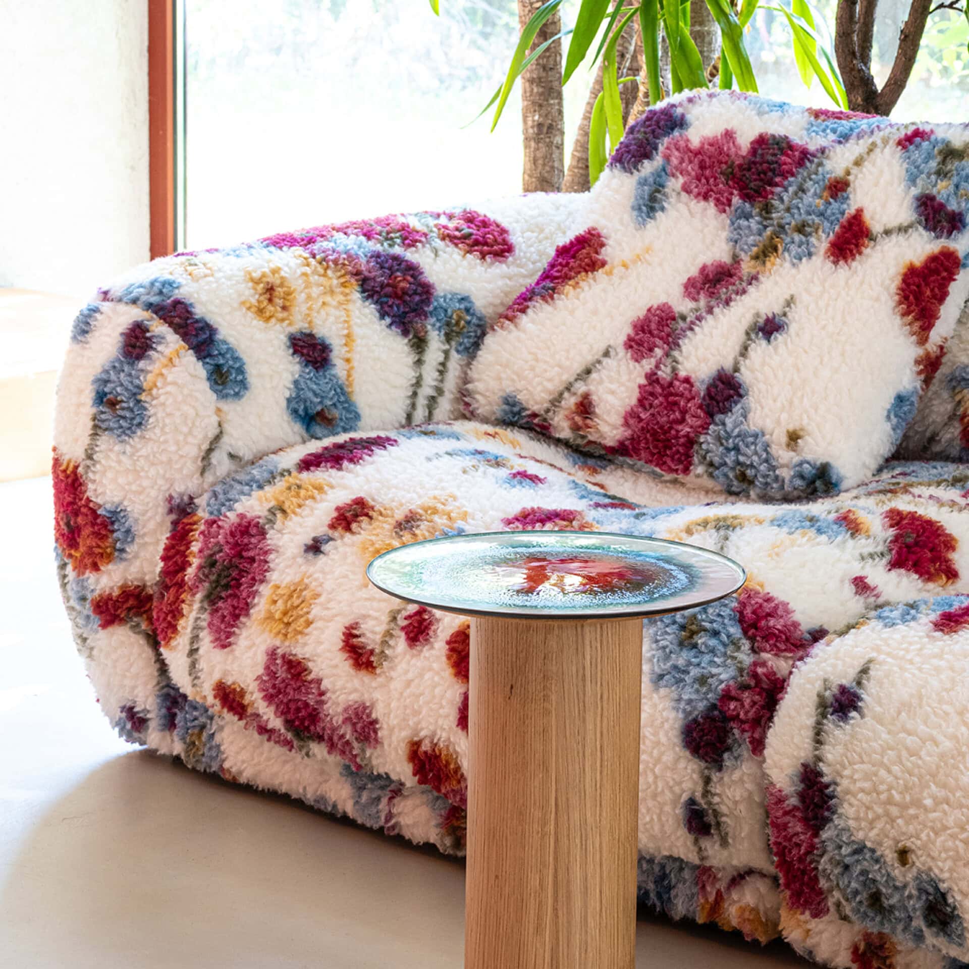 Plush floral-patterned sectional sofa for relaxing and entertaining.