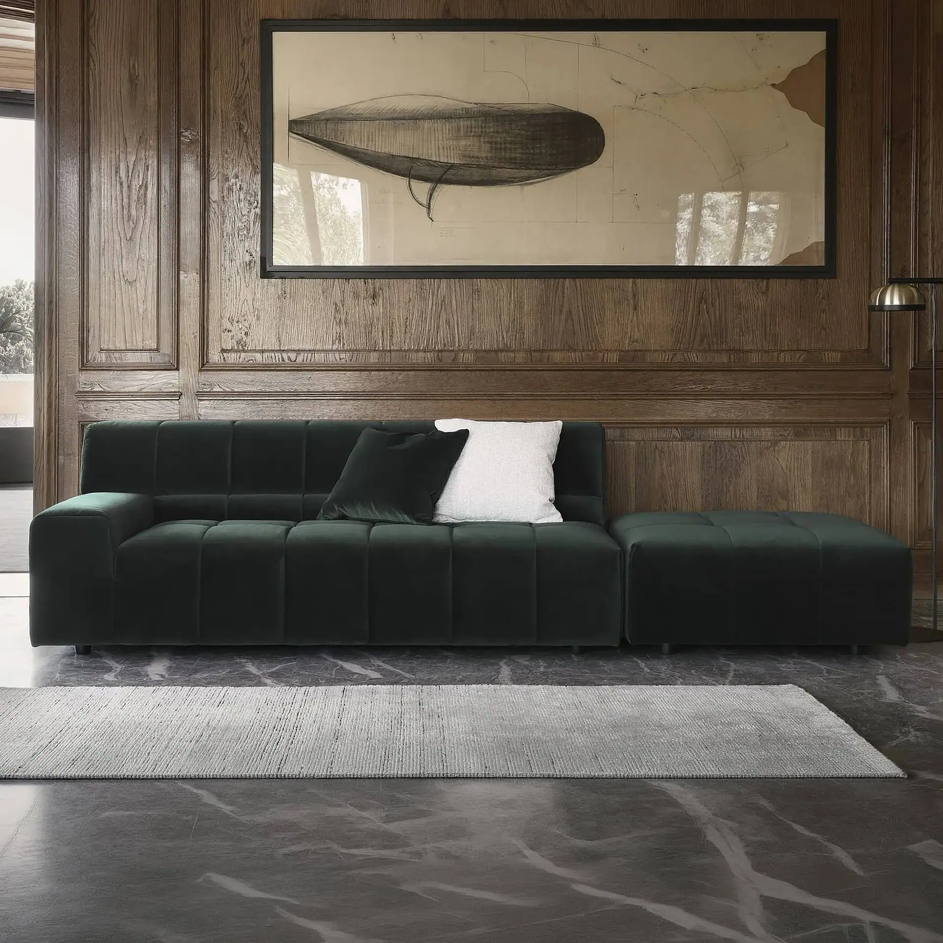 Black sectional sofa with plush cushions in a contemporary living space.