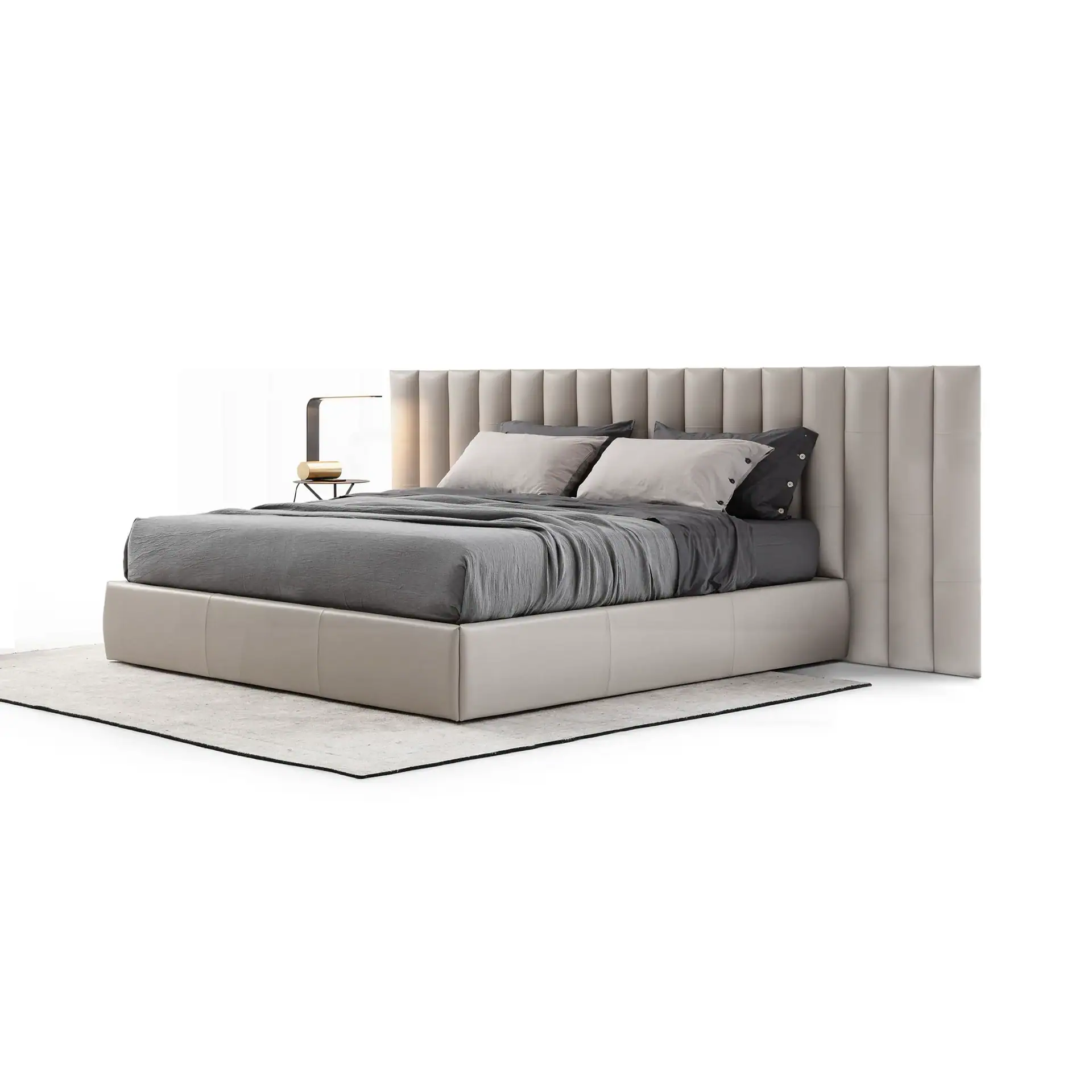 A modern upholstered bed with a tall, paneled headboard in light beige, gray bedding, and a minimalist bedside lamp, on a light gray rug.