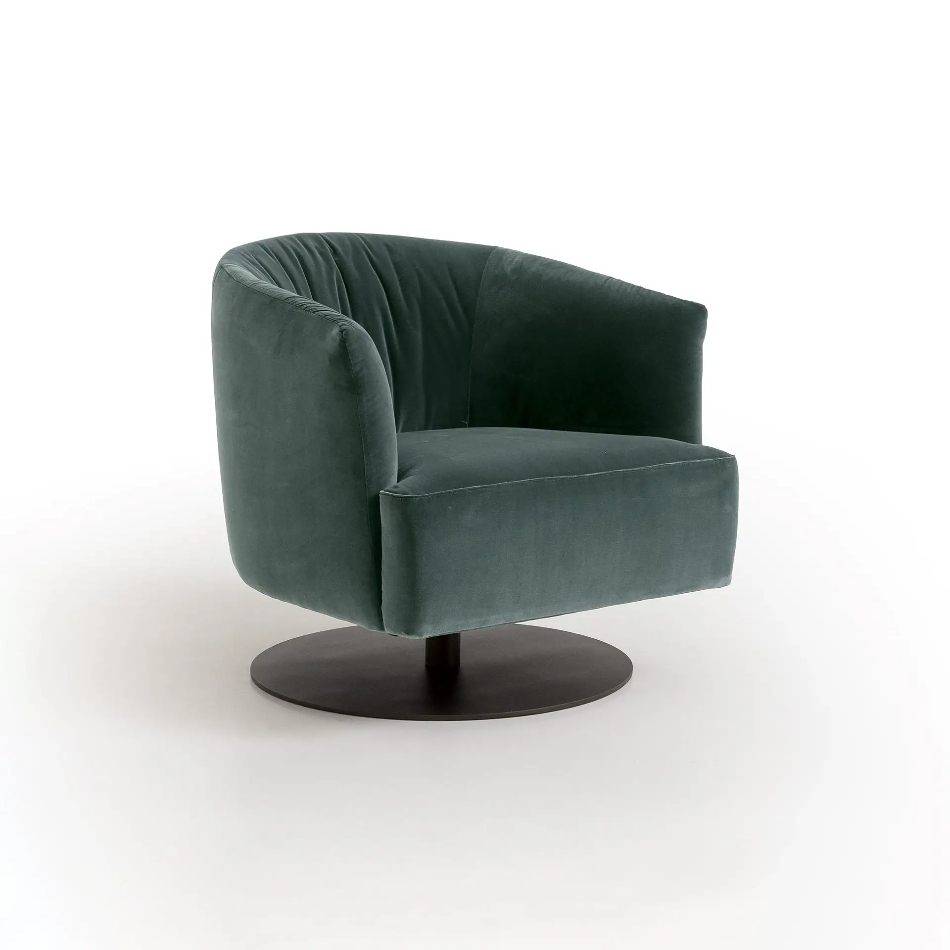 Modern green velvet armchair with rounded back and sleek design.