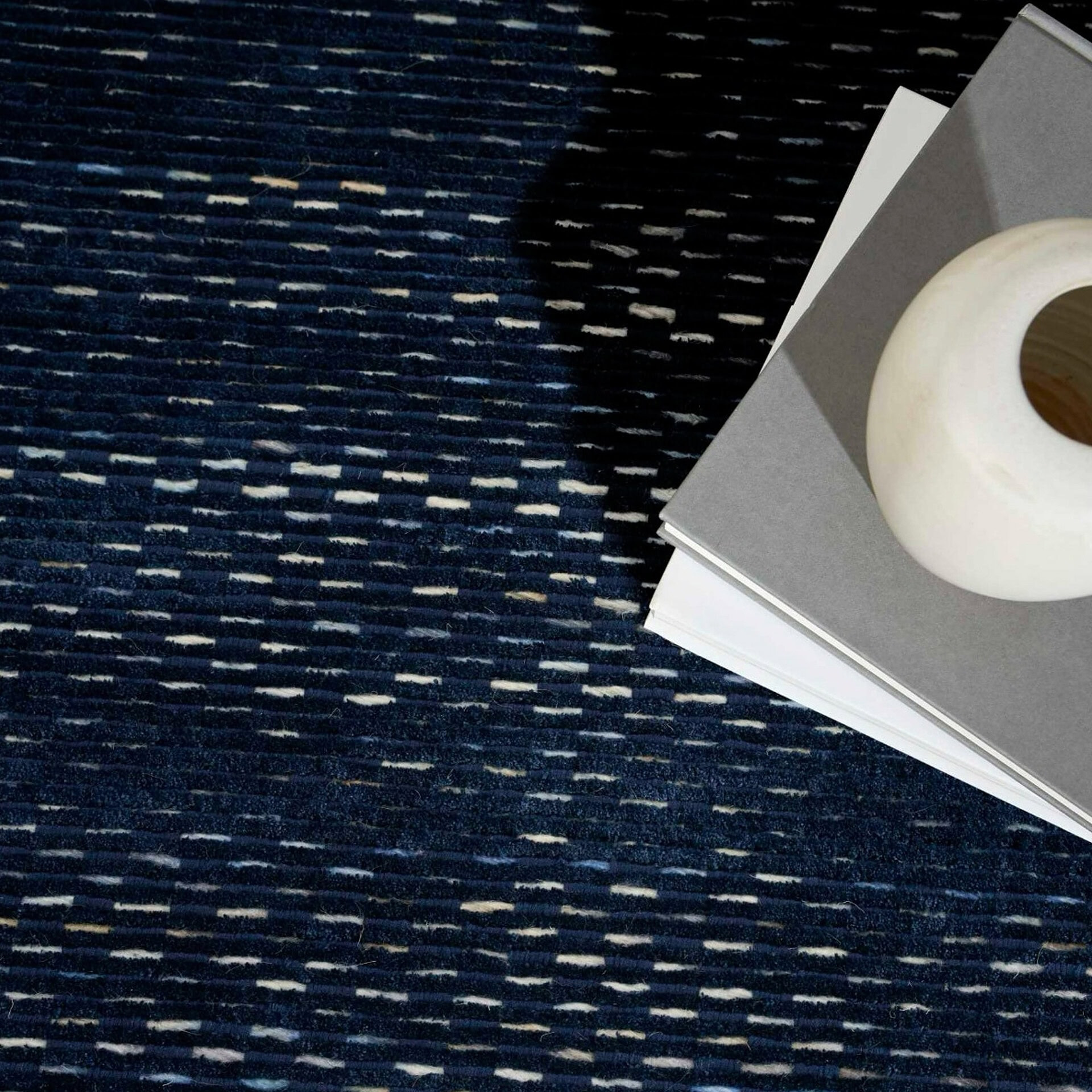 Area Rug with Blue and Beige Pattern for Modern Interiors.