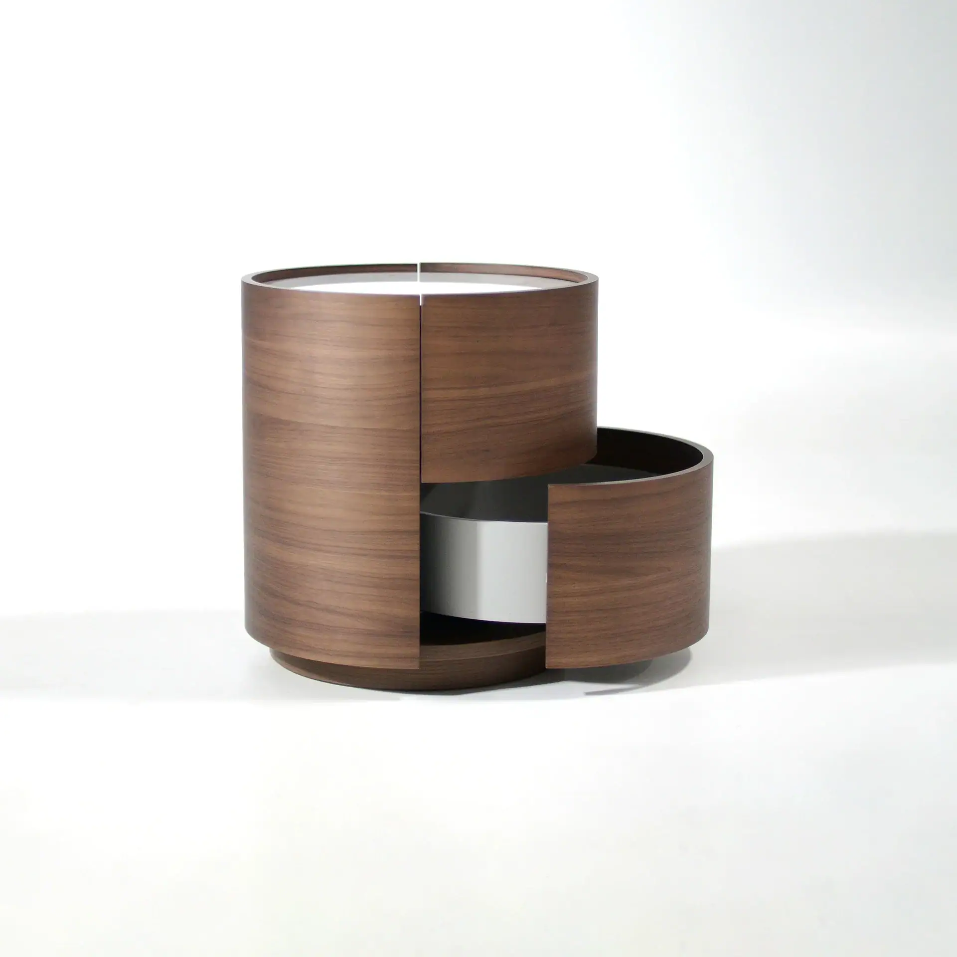 Sklar Furnishings Dedalo Round nightstand with open drawer and black interior.