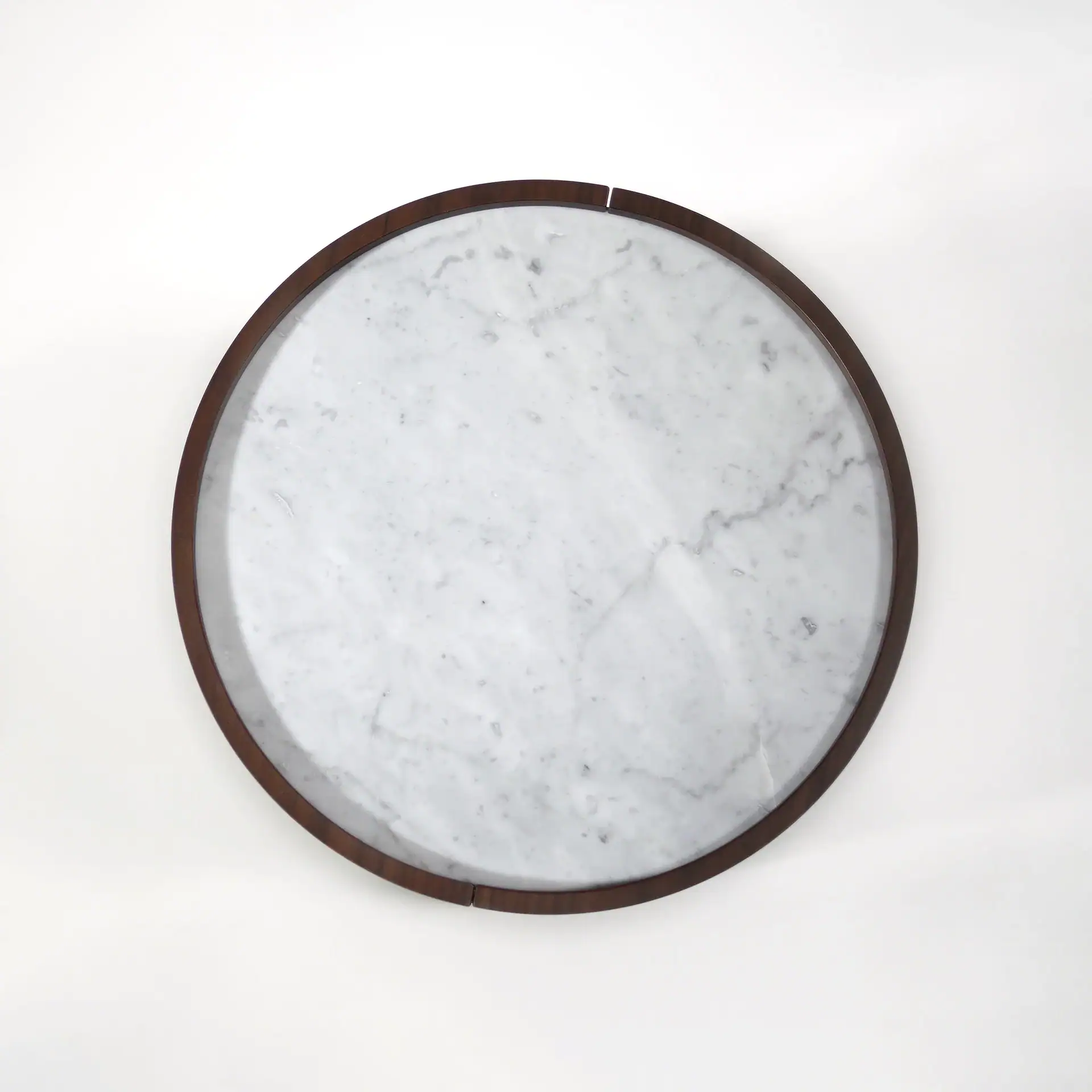 Round marble tray with wooden rim from Sklar Furnishings.
