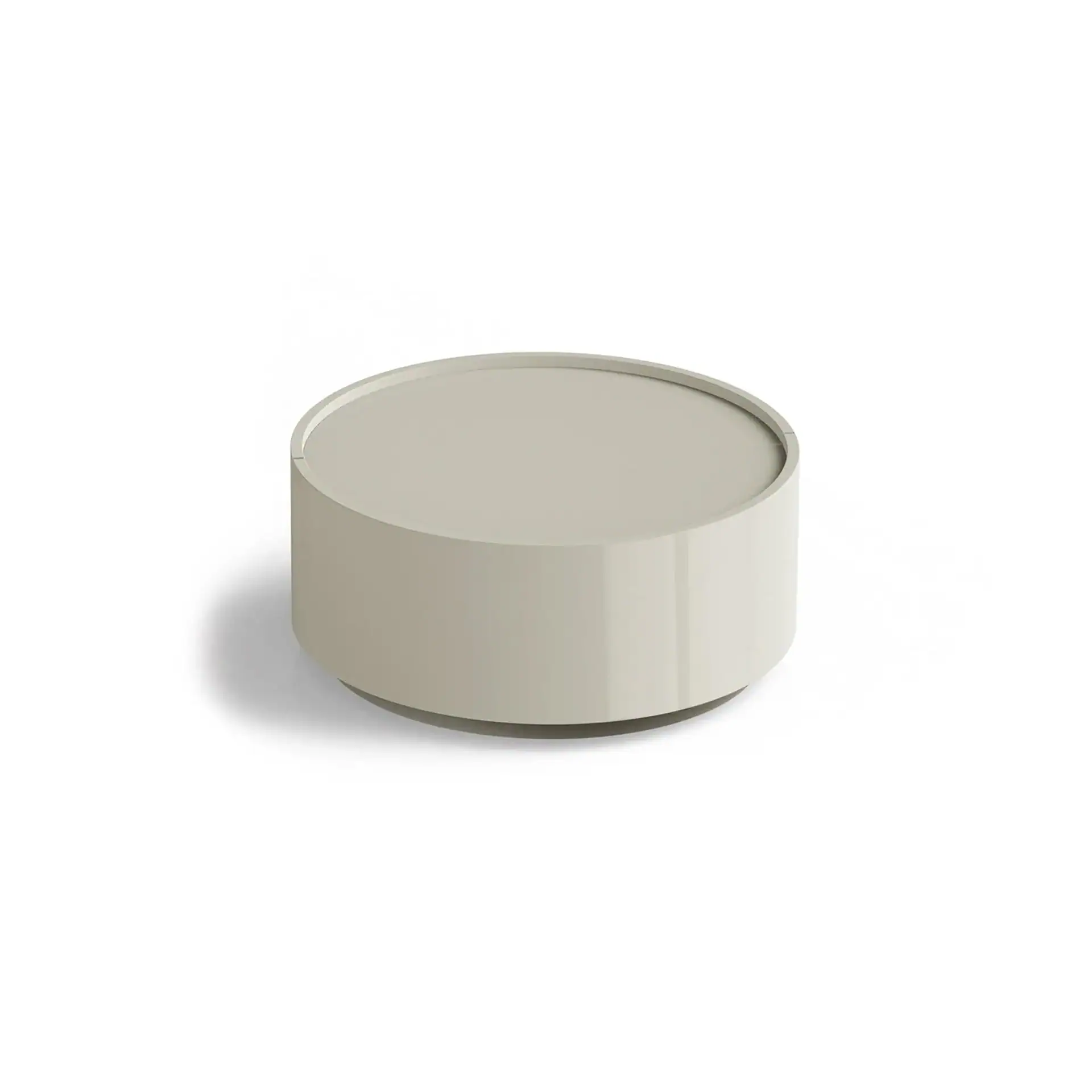 Sklar Furnishings round coffee table with a smooth surface and minimalist design.