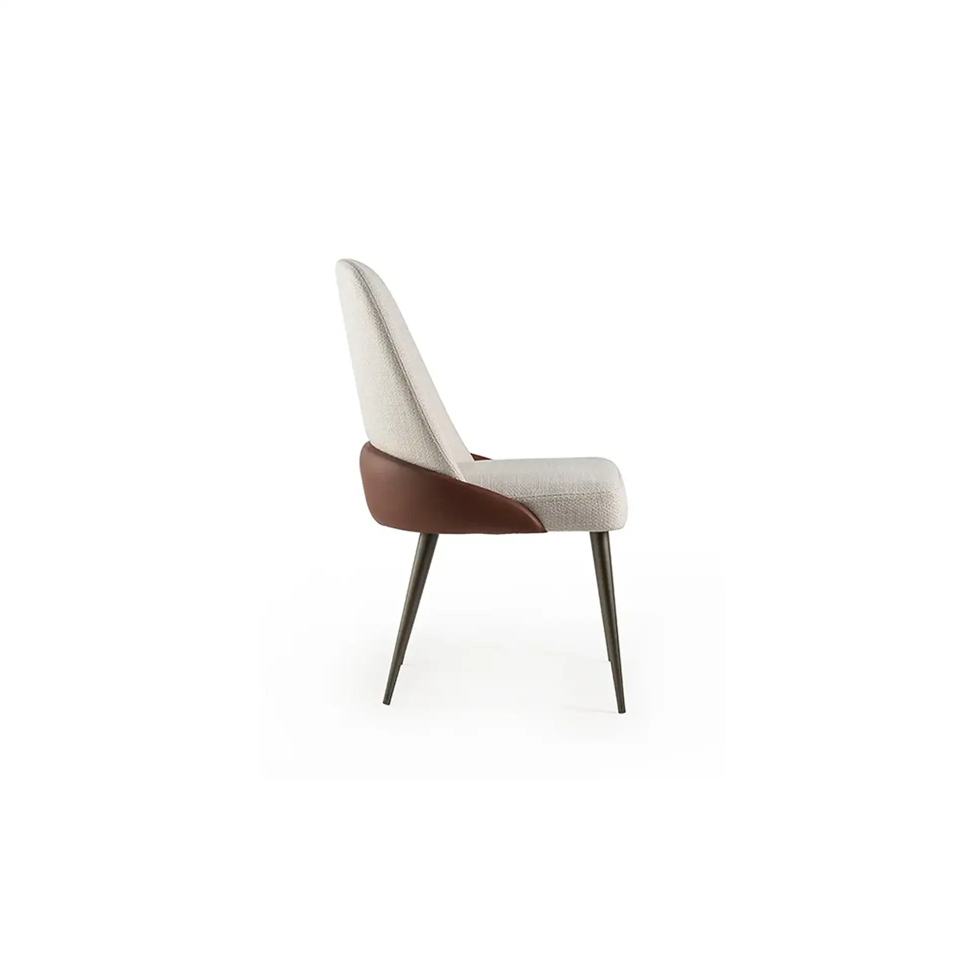 Side view of a modern dining chair with light beige fabric and dark brown leather accents, standing on dark angled legs.
