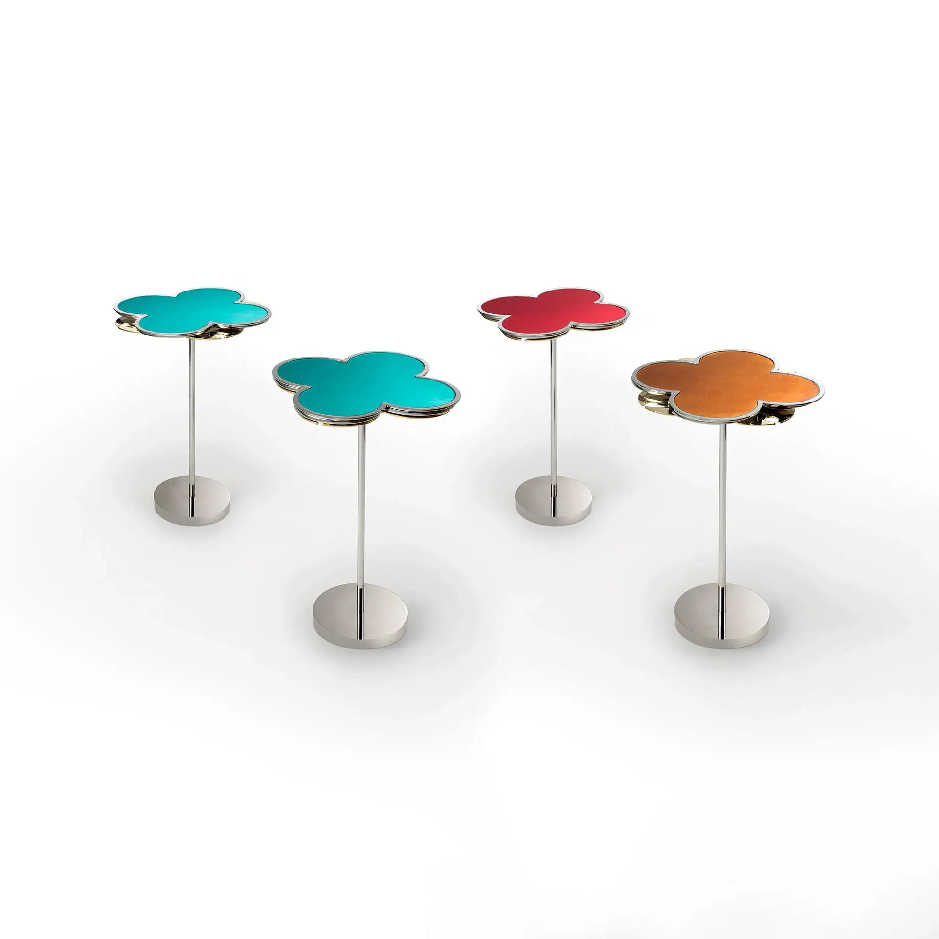 Four flower-shaped stands with metallic bases and poles. Two tops are turquoise, one red, and one orange.