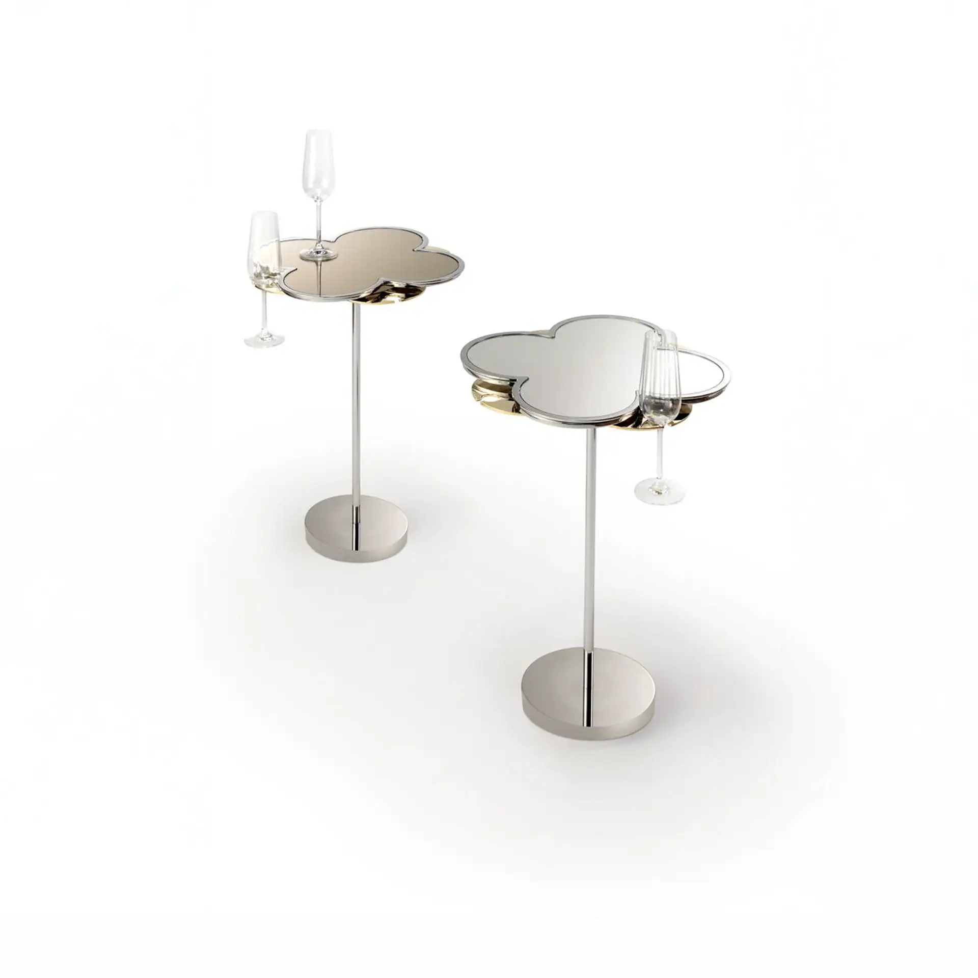 Two modern cloud-shaped side tables with mirrored tops and chrome bases, each holding a champagne flute, on a white background.