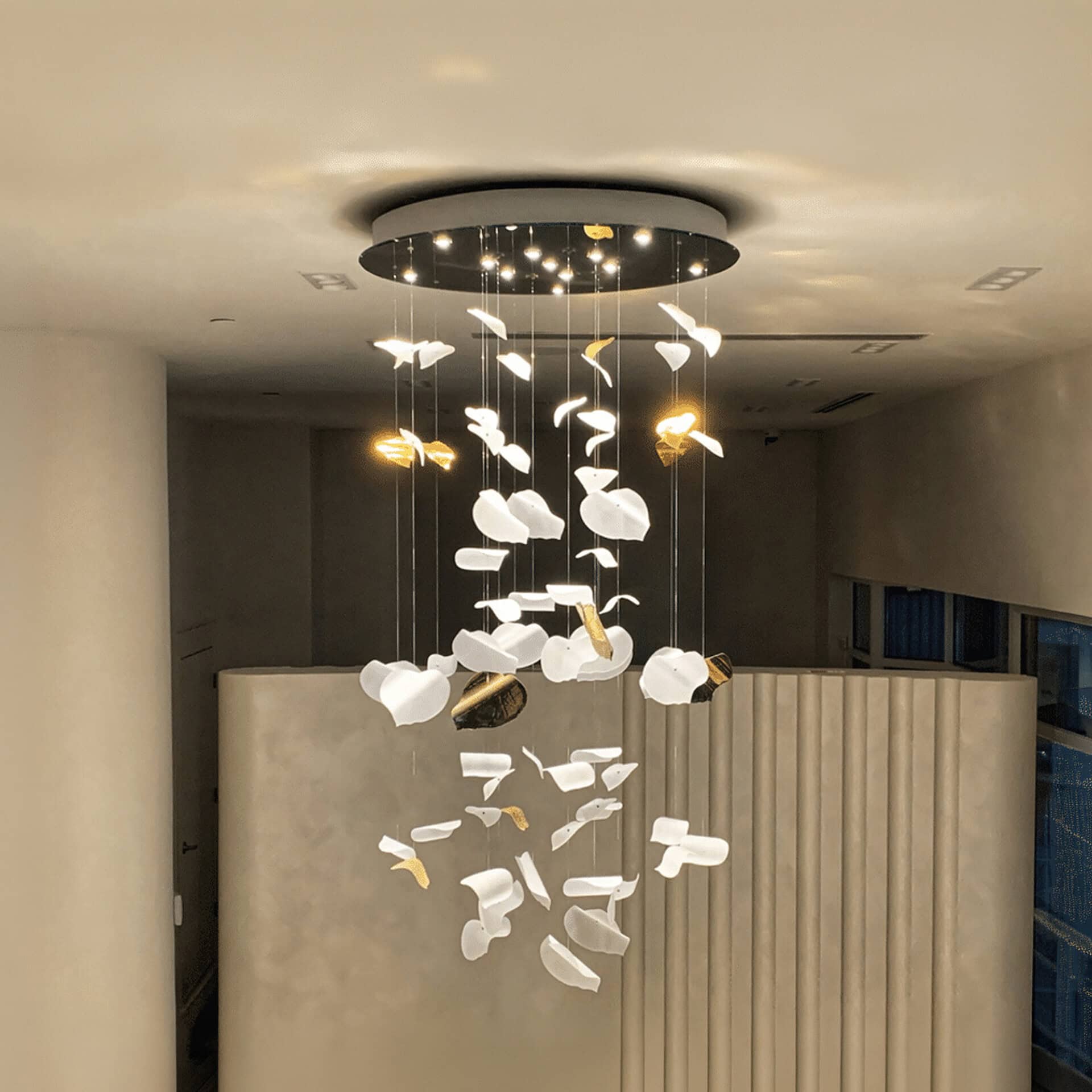 Stylish leaf-shaped glass chandelier with gold accents, perfect for contemporary living spaces and d.