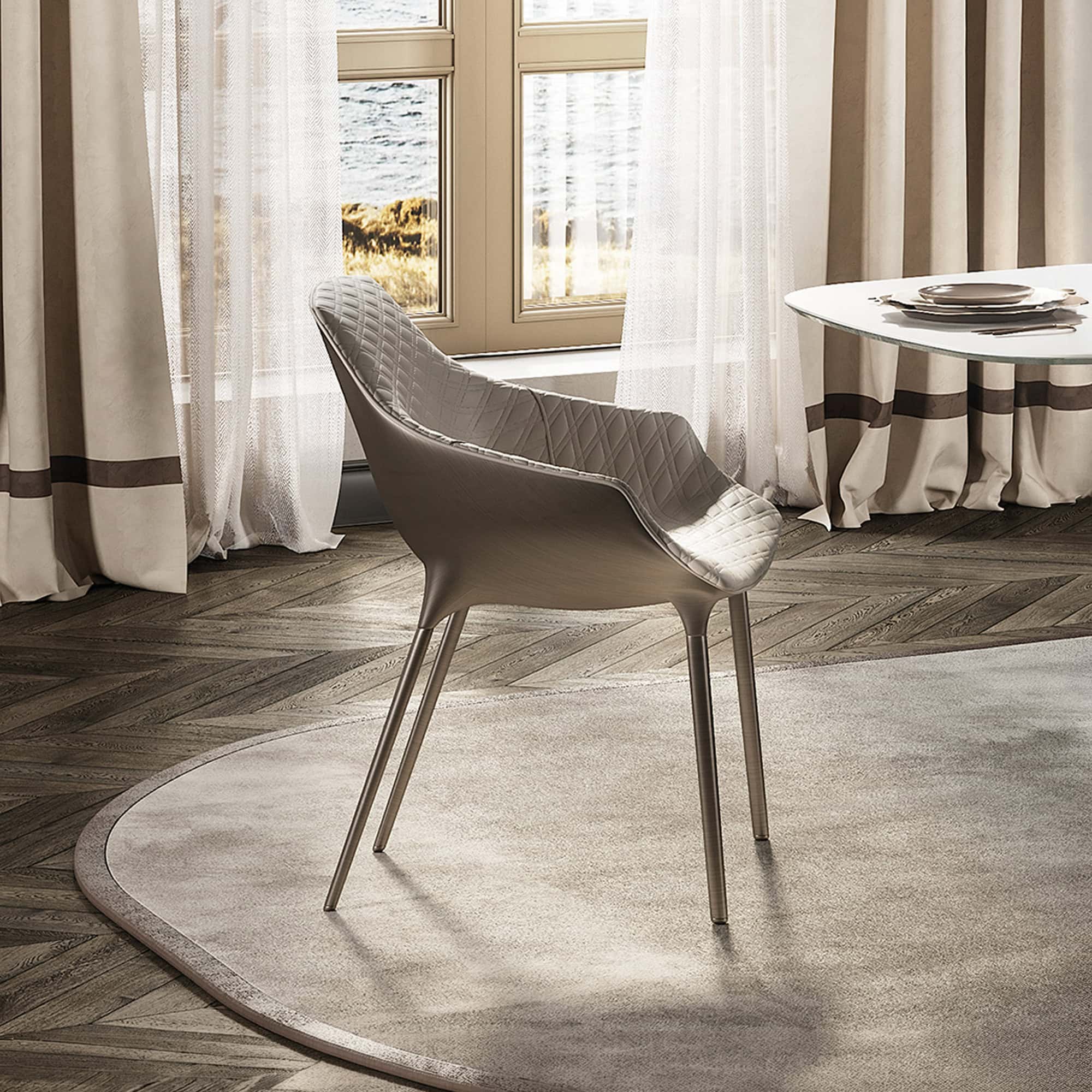 Elegant Milady upholstered dining chair with quilted fabric and sleek metal legs. Perfect for modern.