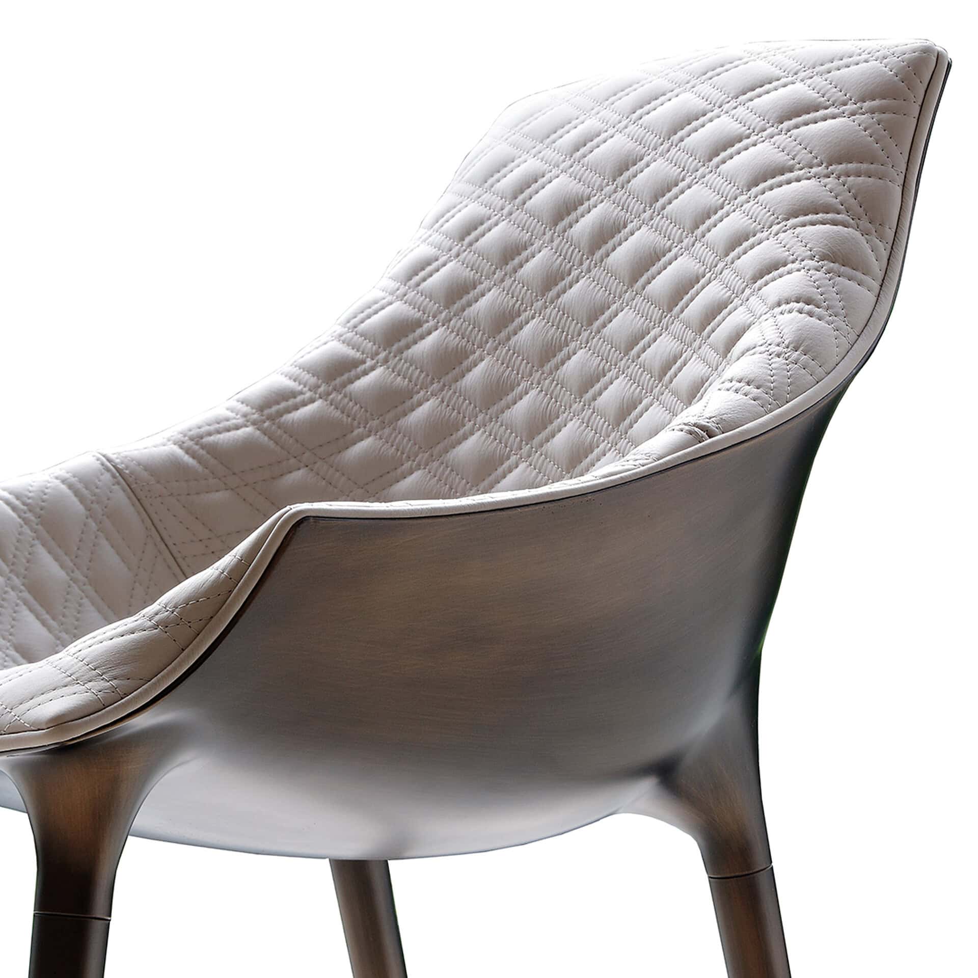 Upholstered dining chair with quilted fabric and sleek wooden frame, perfect for modern dining rooms.