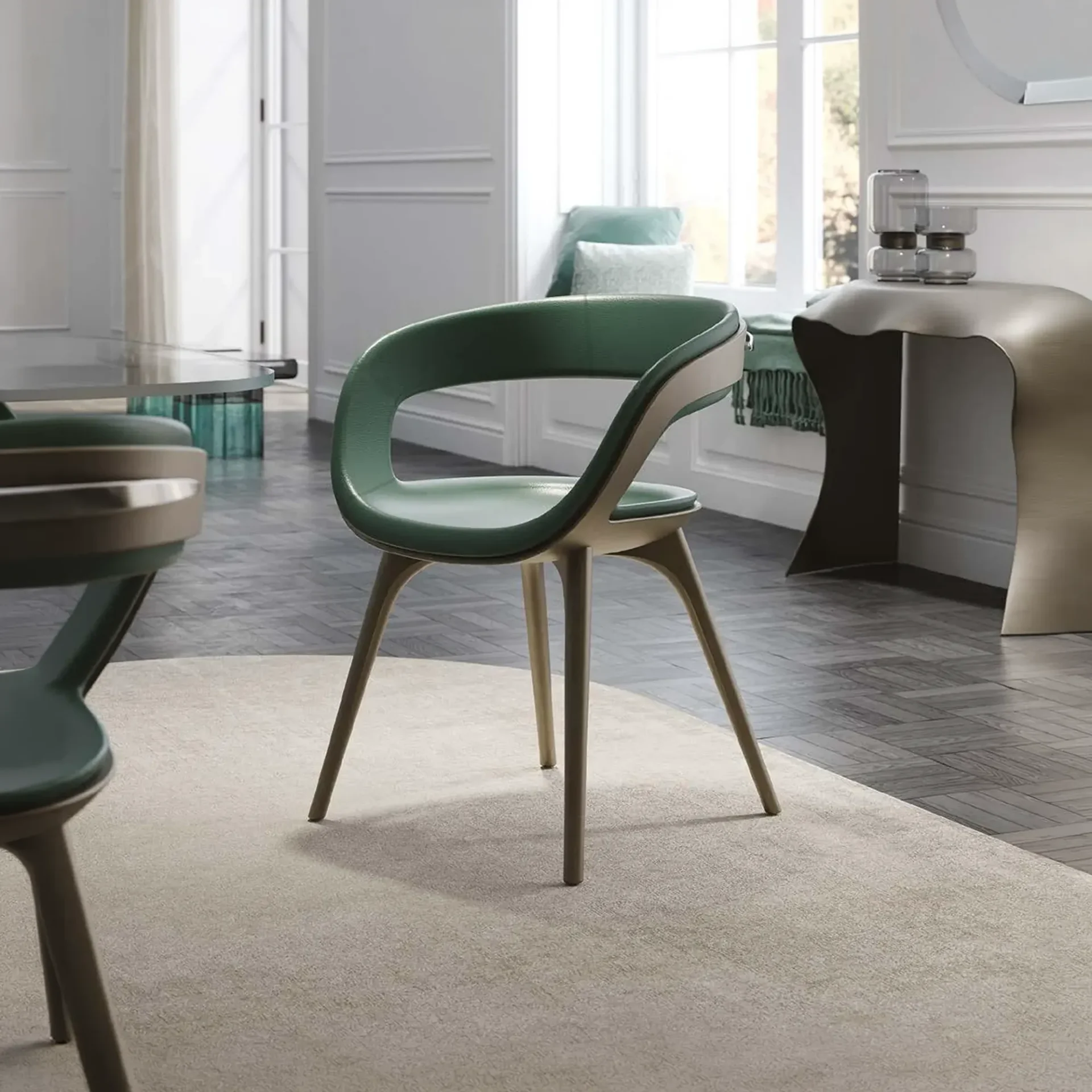 A modern dining chair with green upholstery and light brown wooden legs sits on a beige rug in a bright room with a window and dining table.