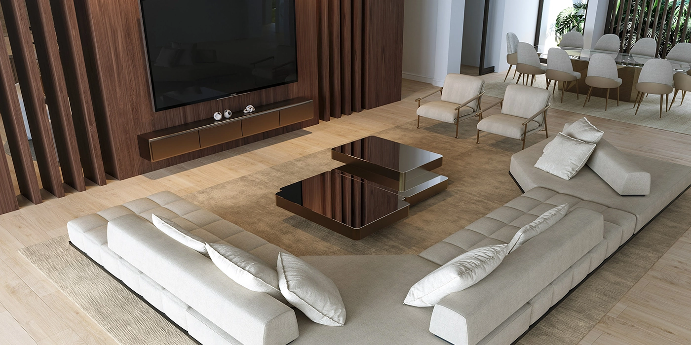 High-angle view of a modern, luxurious open-concept living and dining room. A large beige sectional sofa, dark wood TV wall, two dark coffee tables, and a dining set with glass table and light chairs are visible.