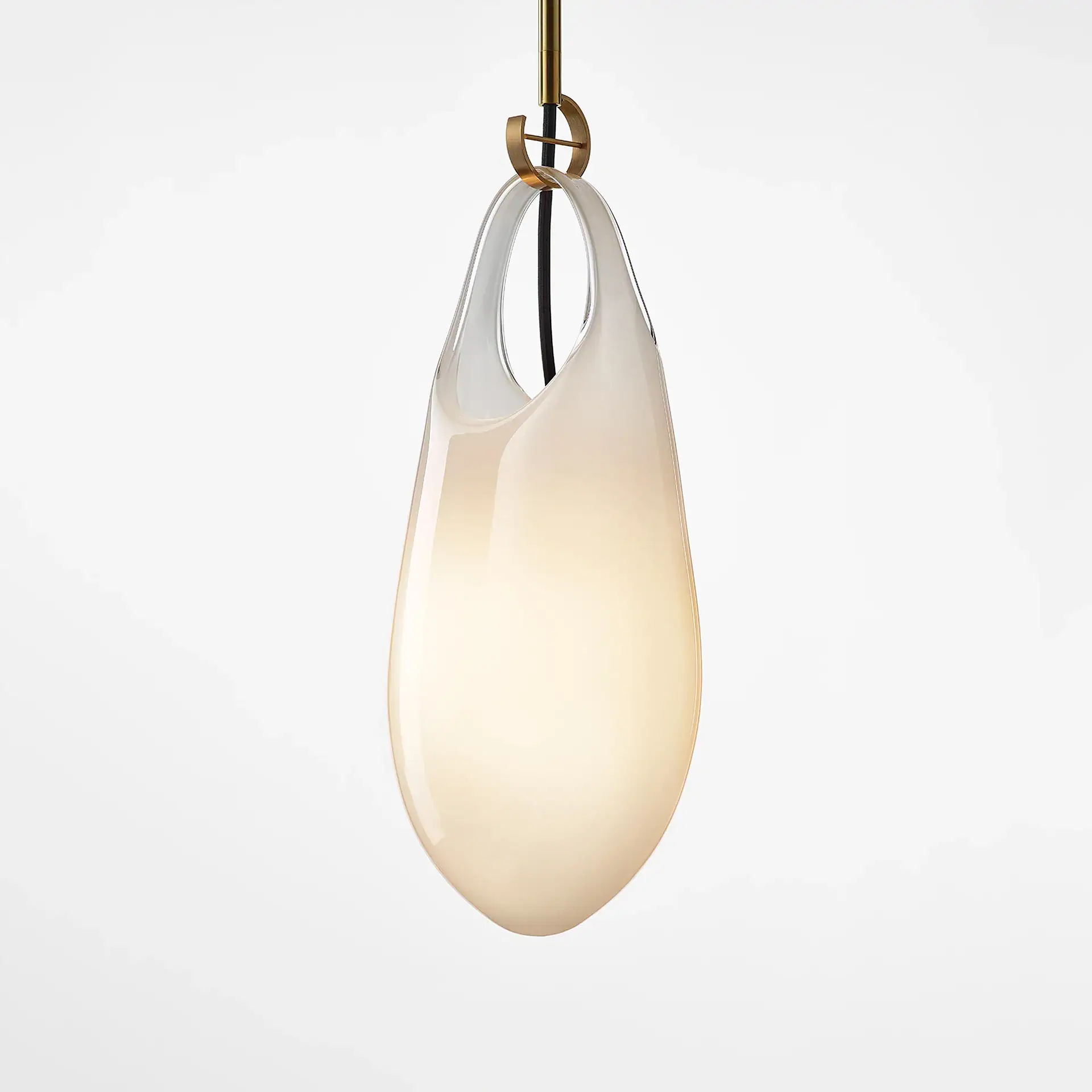 A pear-shaped opalescent glass pendant light with a warm glow, suspended by a brass fitting and dark cord against a white background.