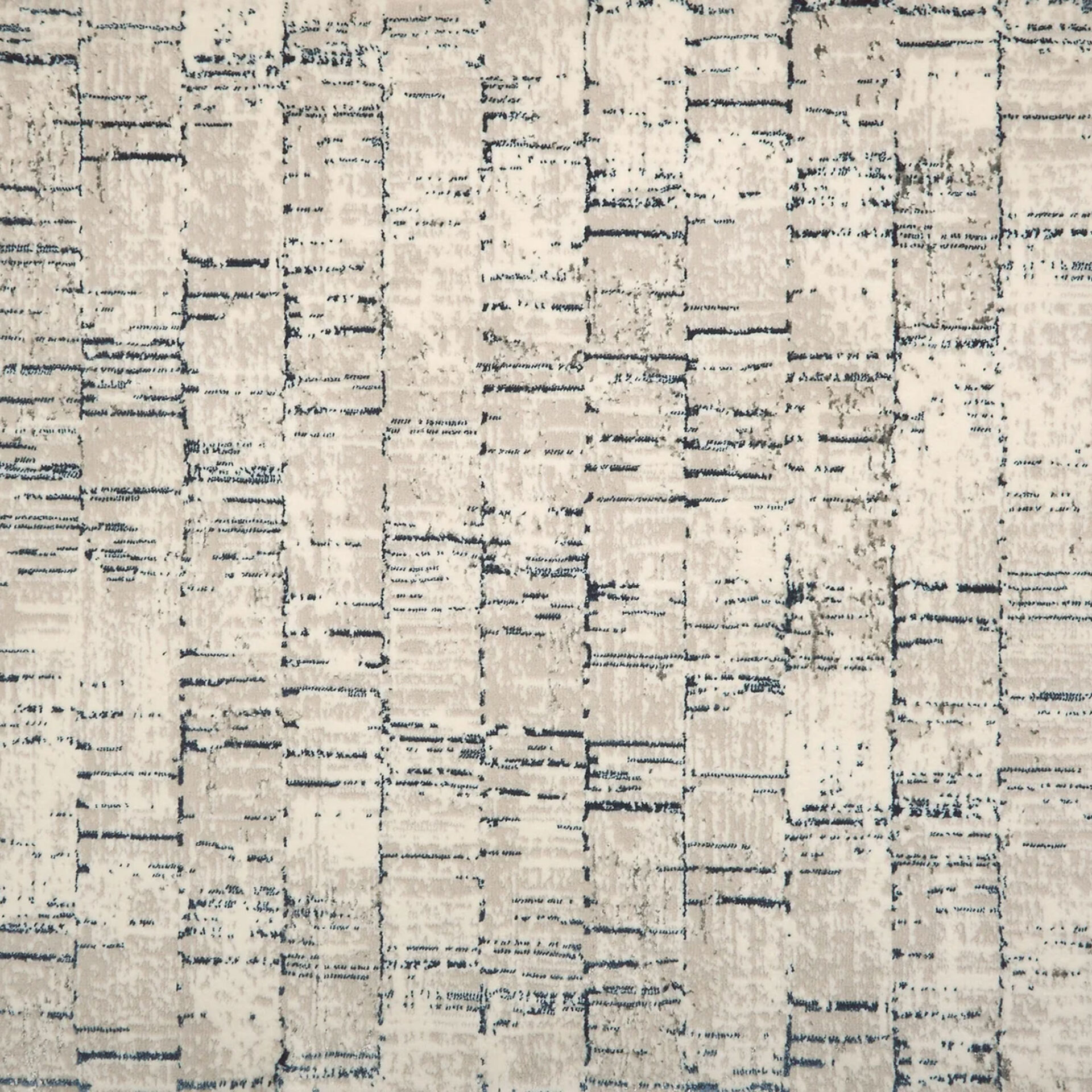 Close-up of an abstract textile pattern in off-white, light beige, and dark blue. The design features a distressed, grid-like arrangement of broken lines and rectangular shapes.