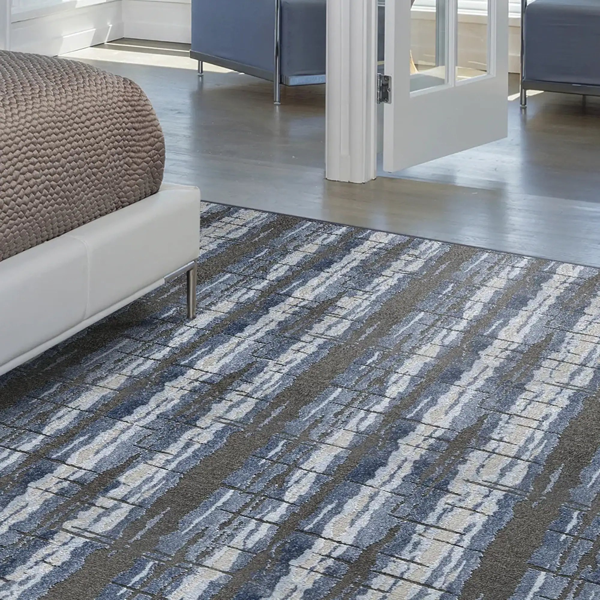 Modern Belladonna patterned area rug in a bright sunlit living room.