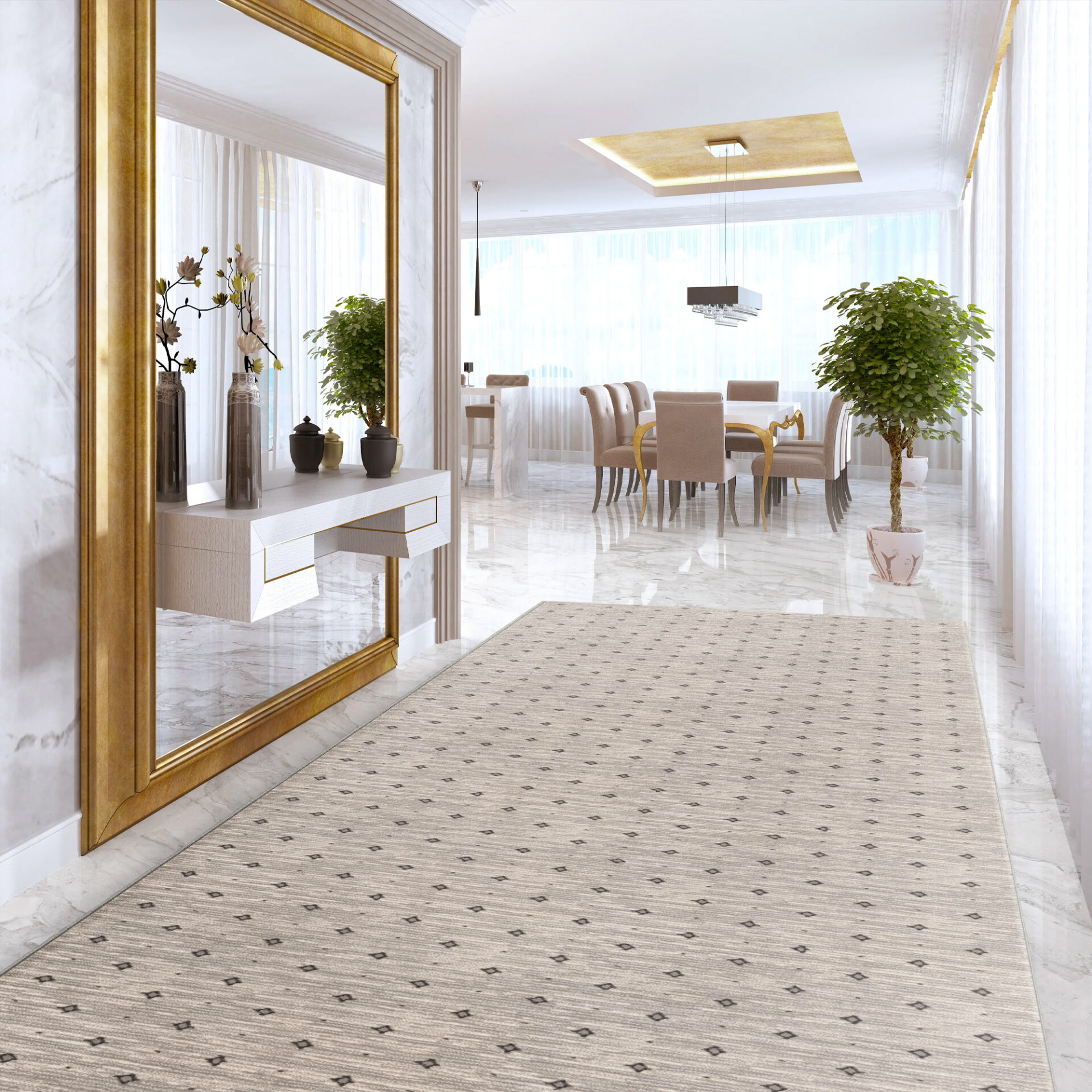 A luxurious entryway with a light patterned runner rug, a large gold-framed mirror above a white console table, leading into a bright dining room with a white table, beige chairs, and a potted plant.