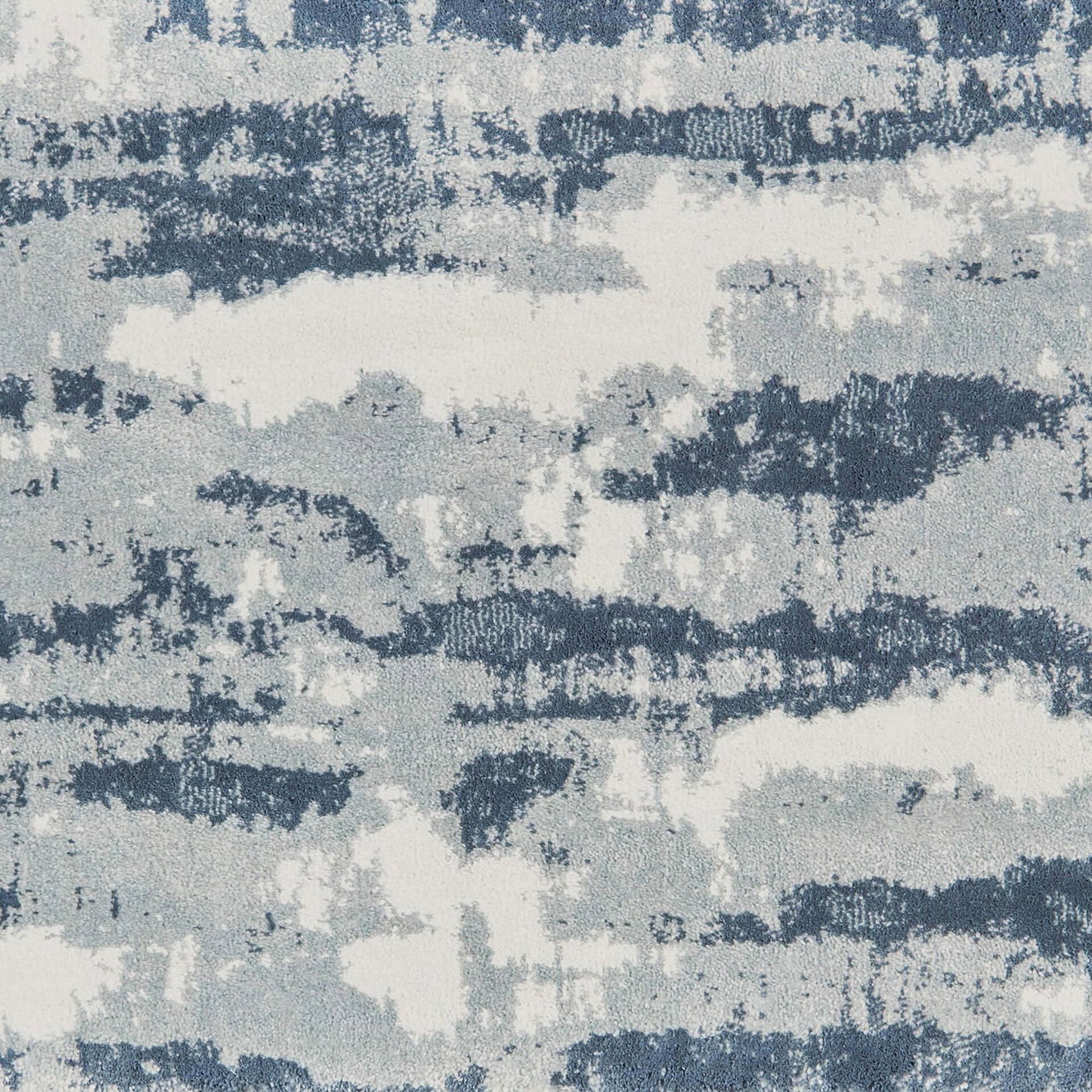 Woven carpet with abstract blue and gray pattern for contemporary interiors.