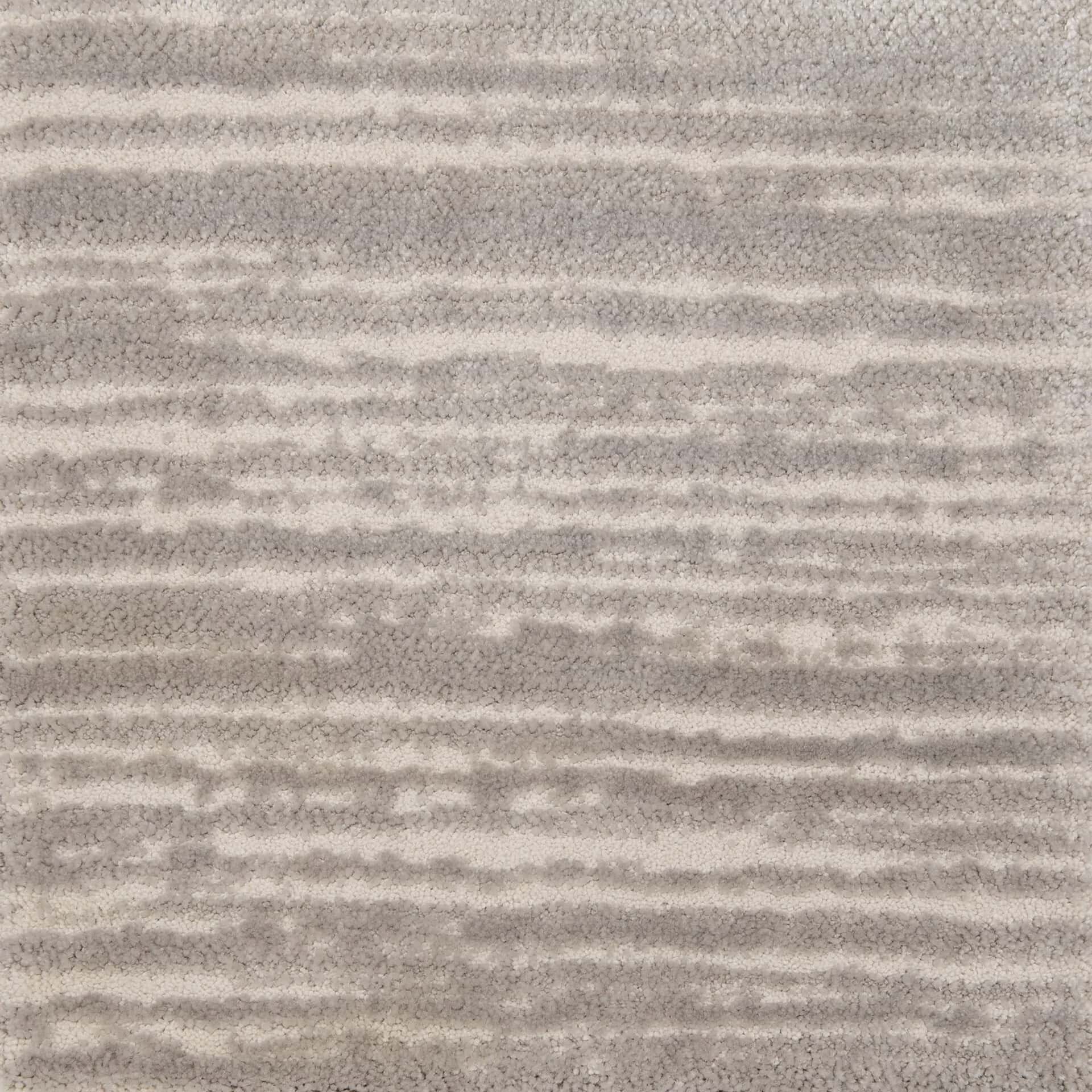 Modern rock star patterned area rug in neutral tones for stylish home decor.