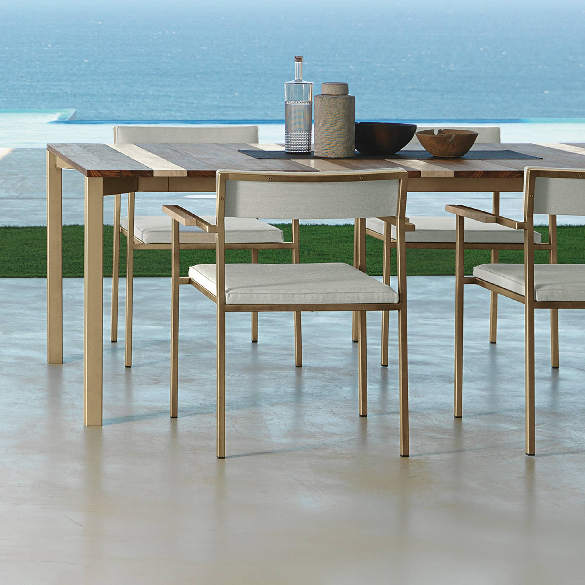 Outdoor dining chair with a sleek wooden frame and comfortable cushion. Perfect for seaside patios a.
